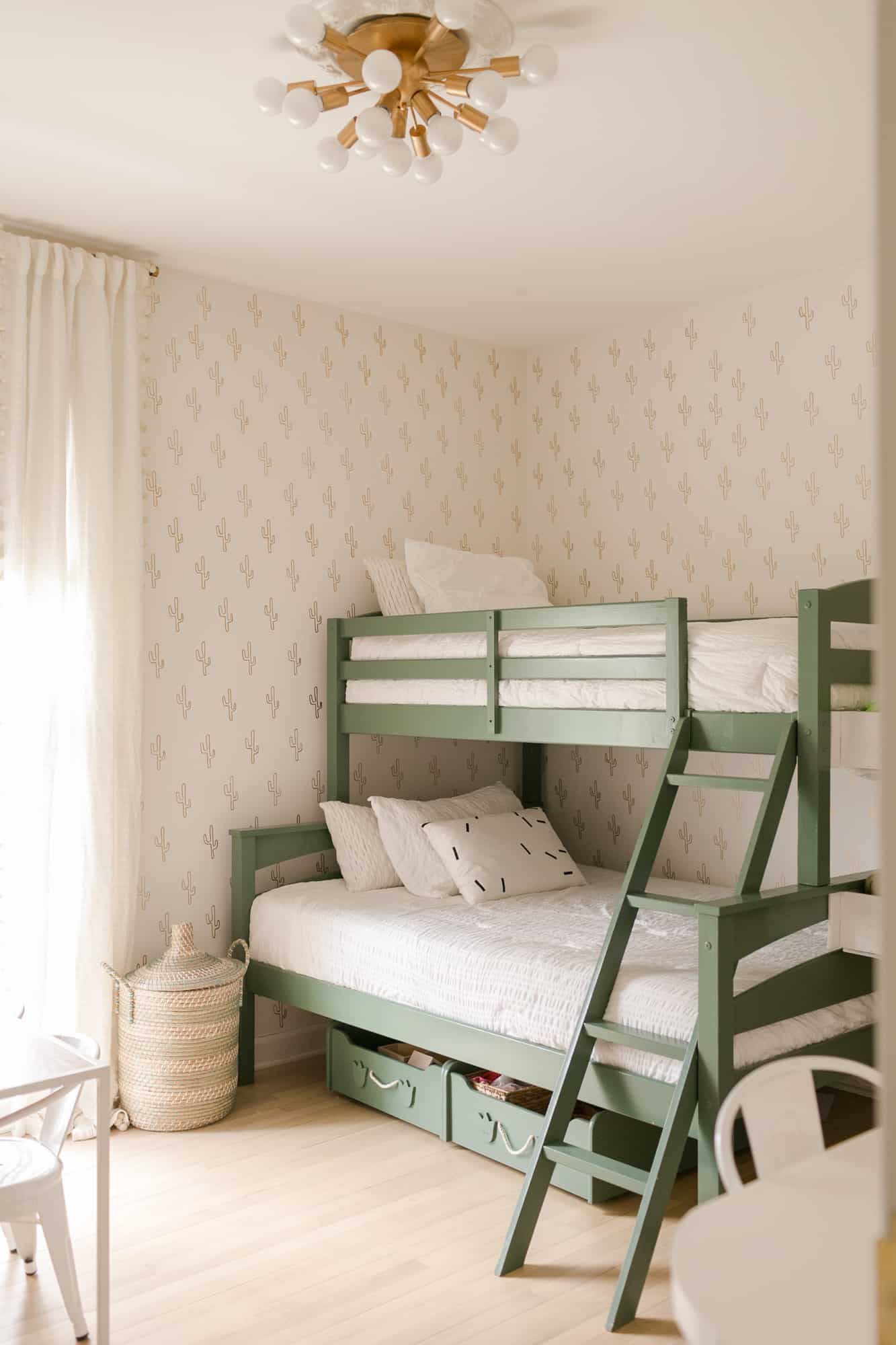 gender neutral shared bedroom with twin over full bunk painted green