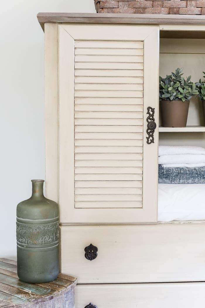 Faux Antique Shutter Armoire Makeover | blesserhouse.com - A basic veneer cabinet gets a faux antique makeover using Fusion Mineral Paint in the color Plaster aged with Espresso wax and cast iron hardware. 