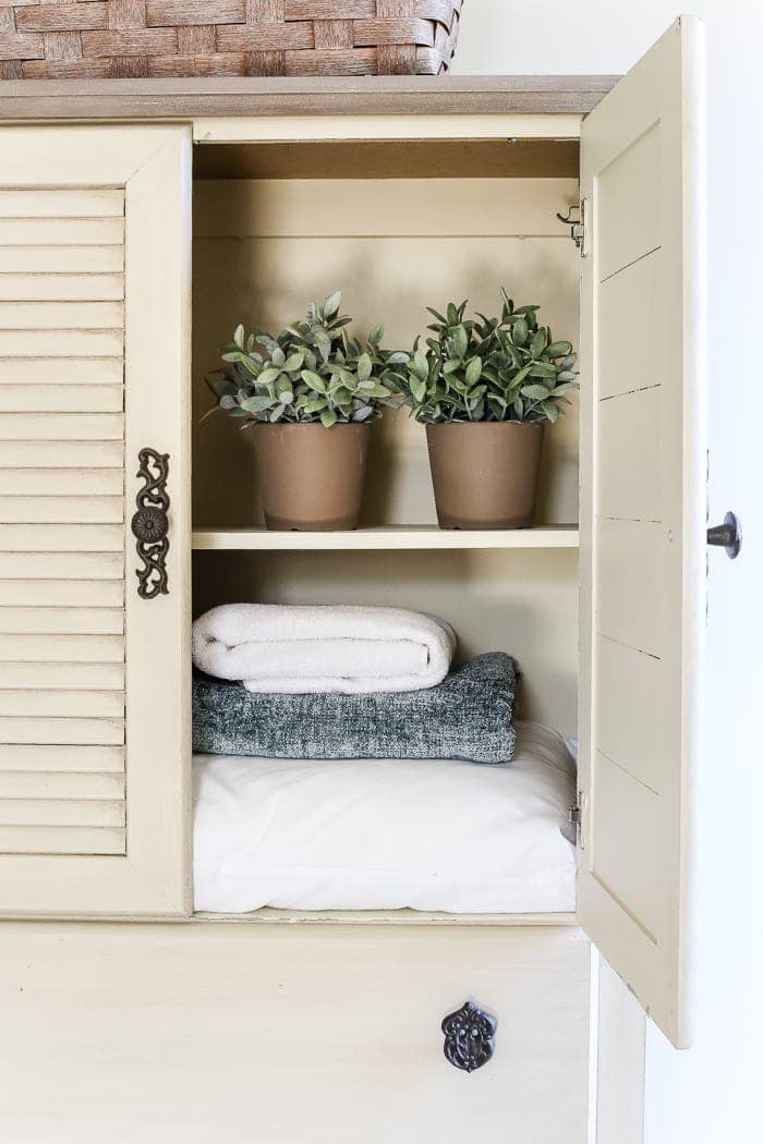 Faux Antique Shutter Armoire Makeover | blesserhouse.com - A basic veneer cabinet gets a faux antique makeover using Fusion Mineral Paint in the color Plaster aged with Espresso wax and cast iron hardware. 