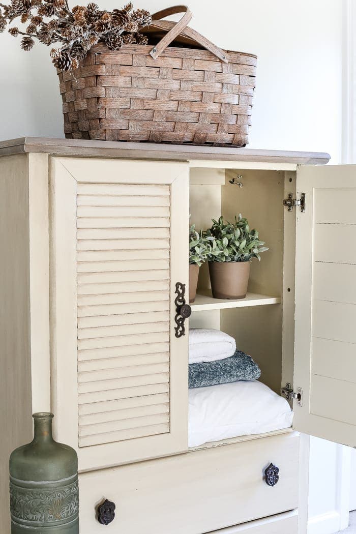 Faux Antique Shutter Armoire Makeover | blesserhouse.com - A basic veneer cabinet gets a faux antique makeover using Fusion Mineral Paint in the color Plaster aged with Espresso wax and cast iron hardware. 
