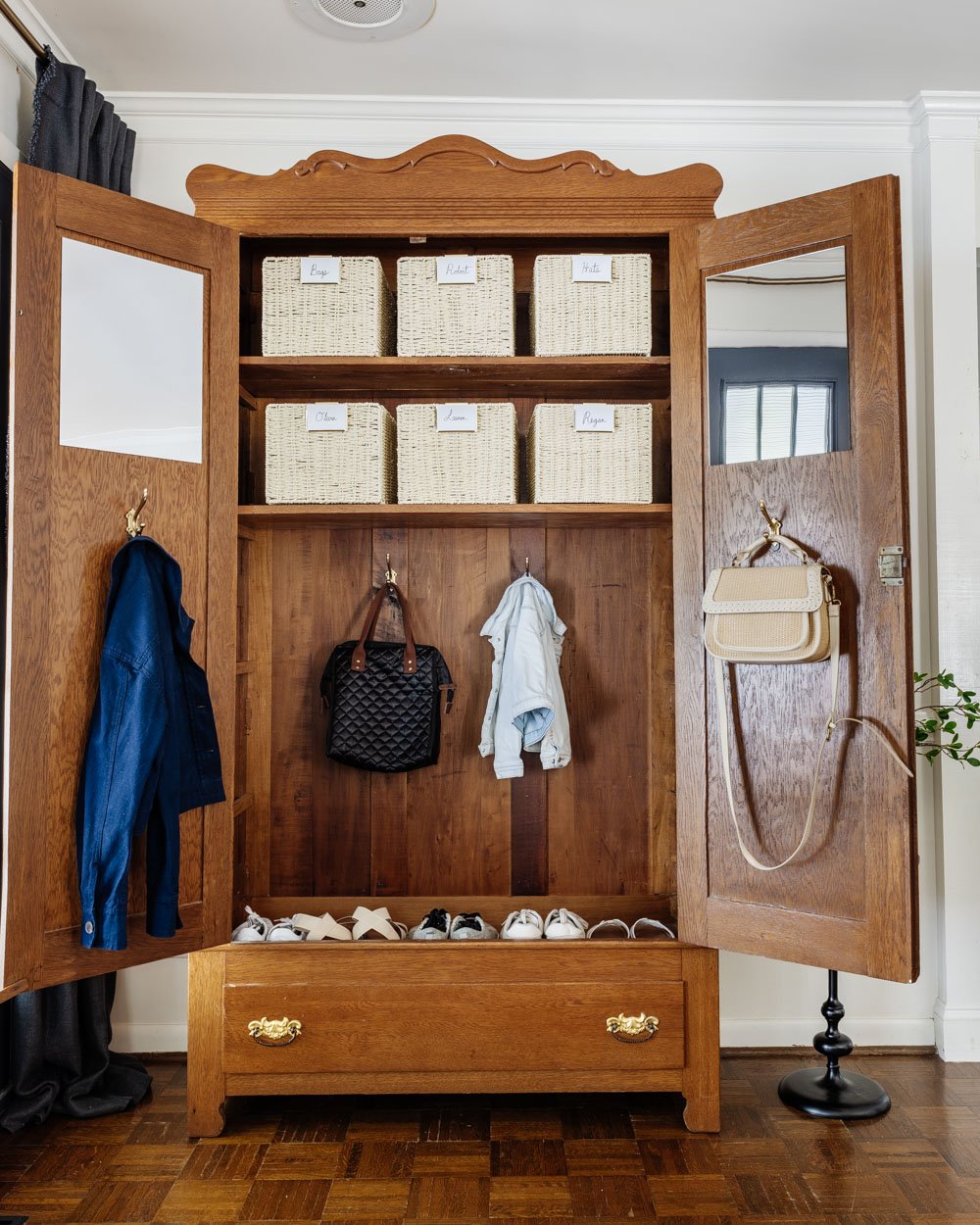 armoire coat closet in an entryway for storage without a mudroom