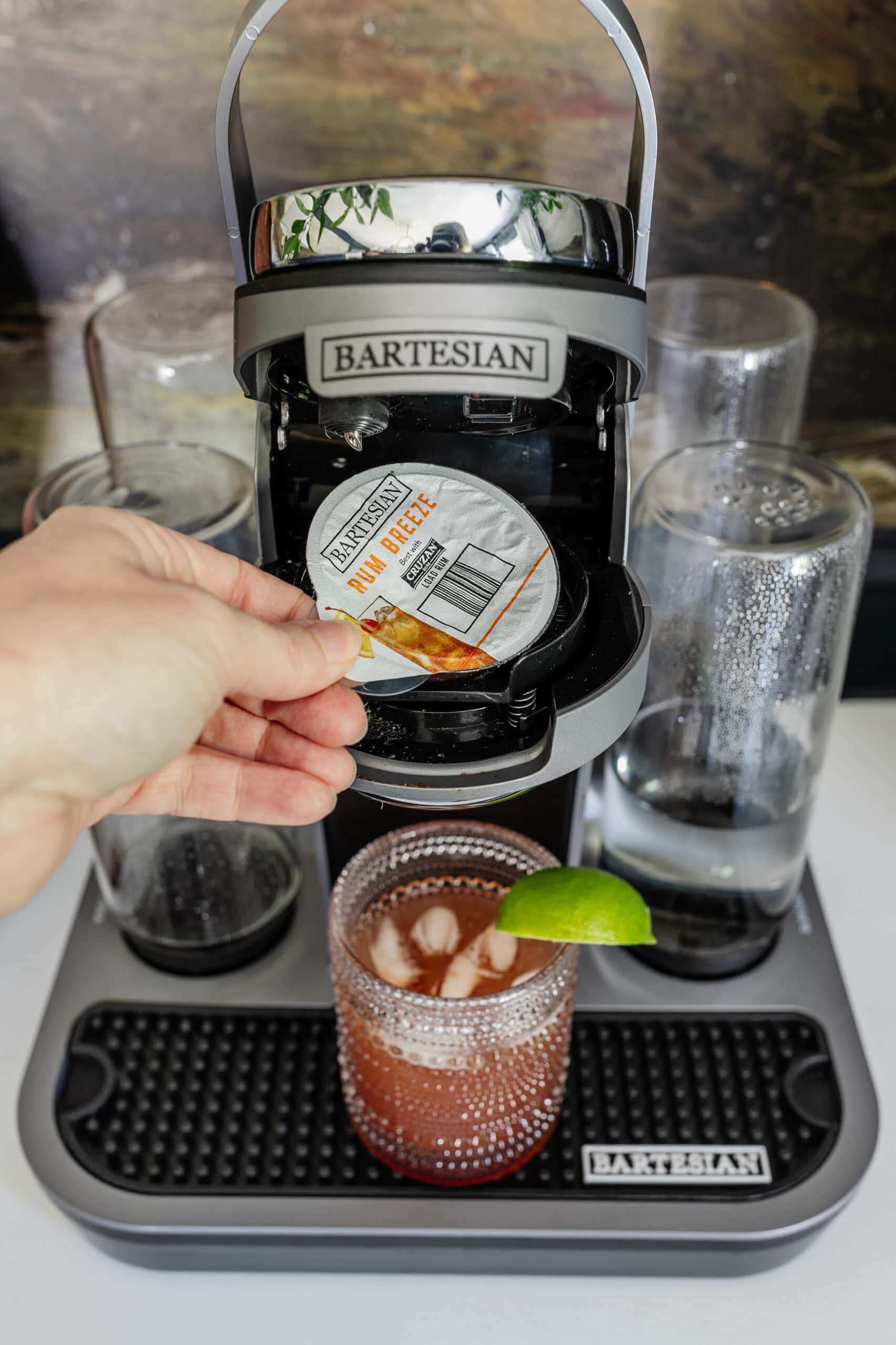 adding a cocktail capsule to a bartesian machine
