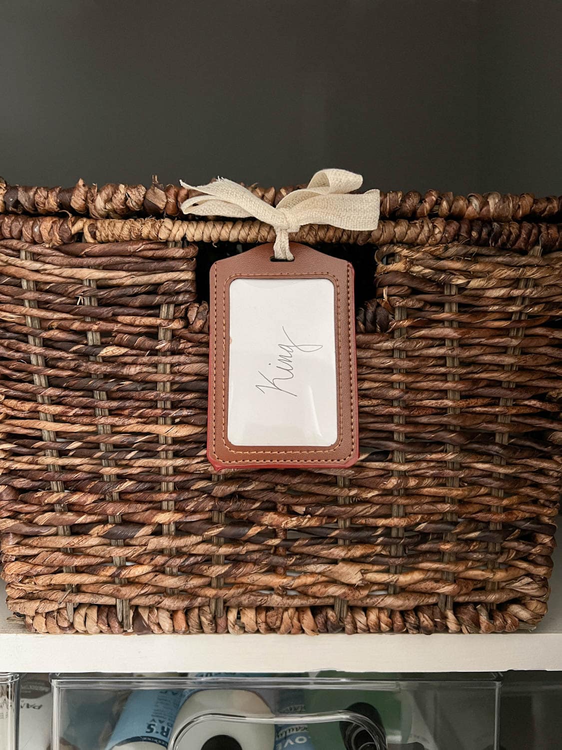 sheet set storage in basket with lanyard label