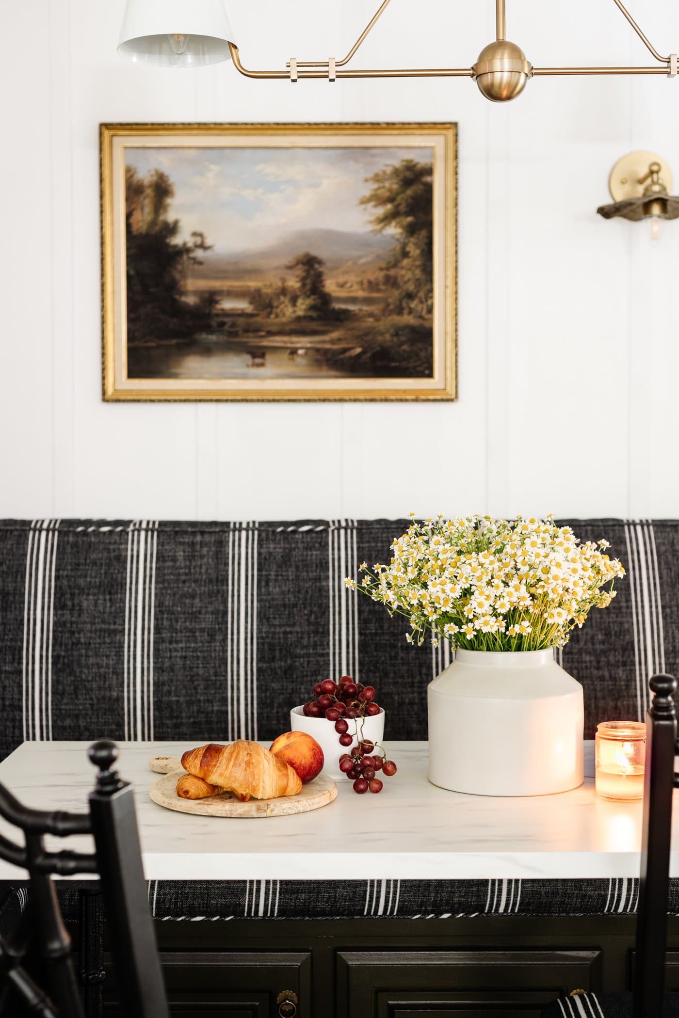 thrifted home decor on a table with thrifted framed art