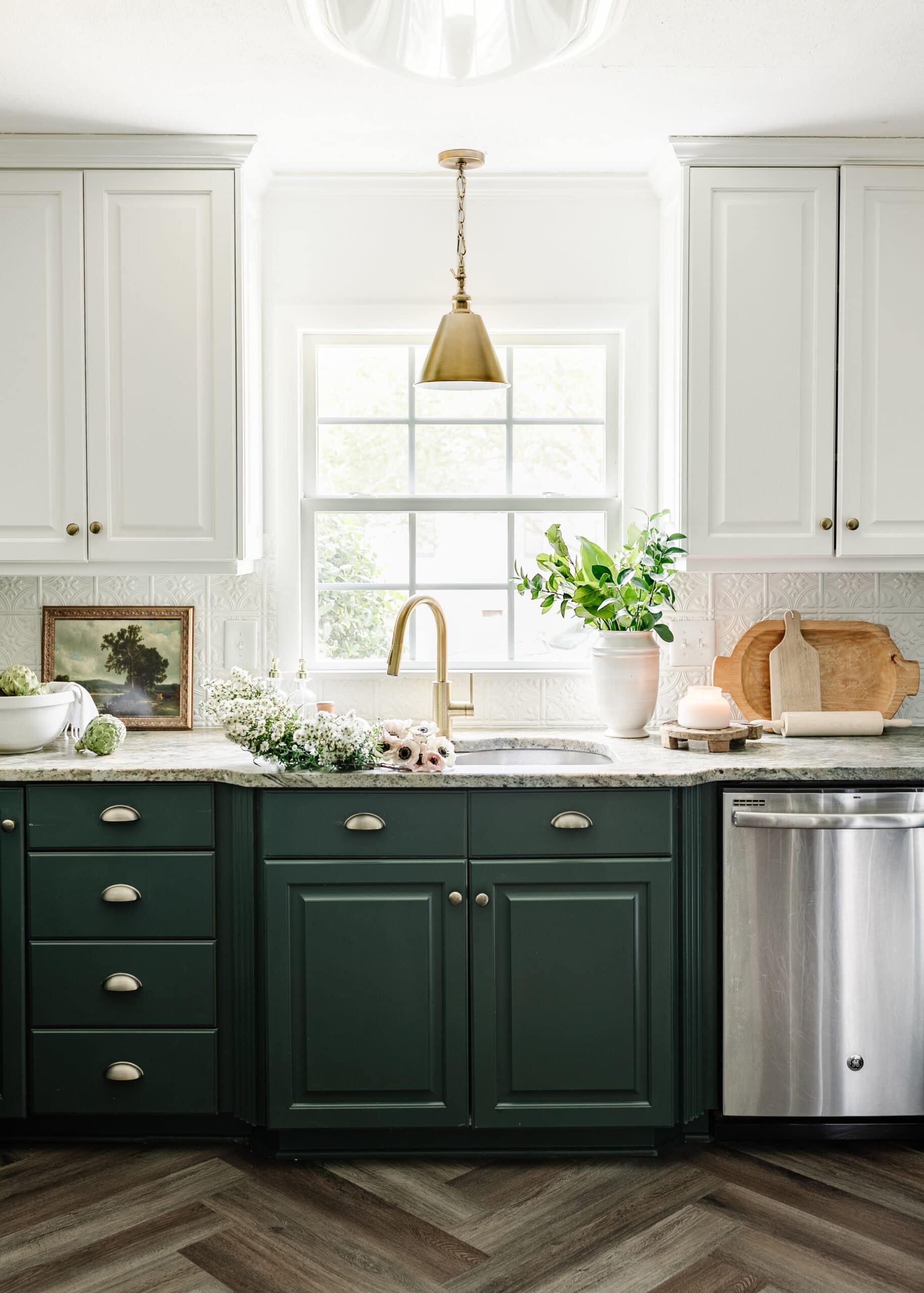 organized kitchen with green cabinets
