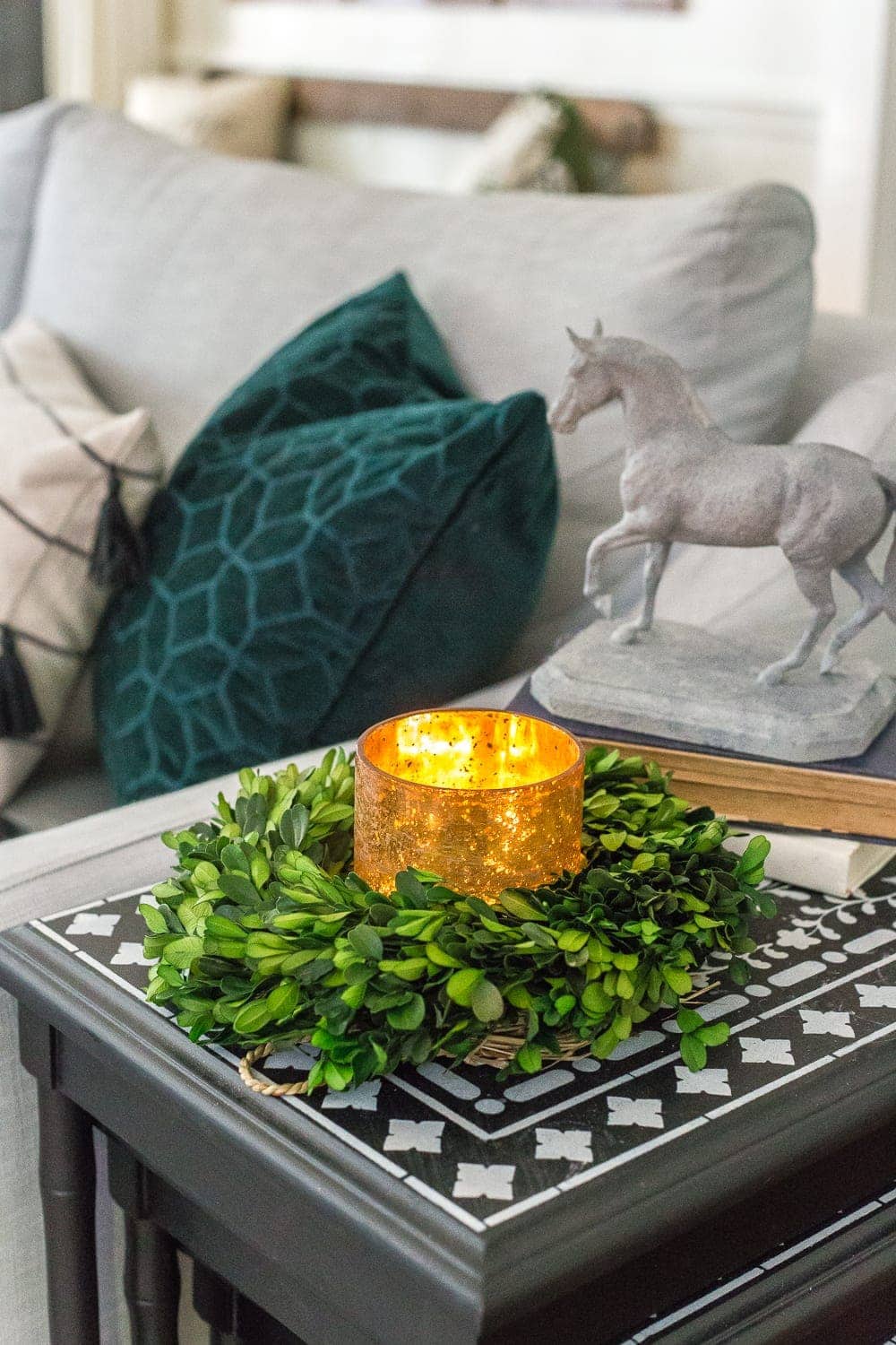 Mini wreath repurposed as a candle ring