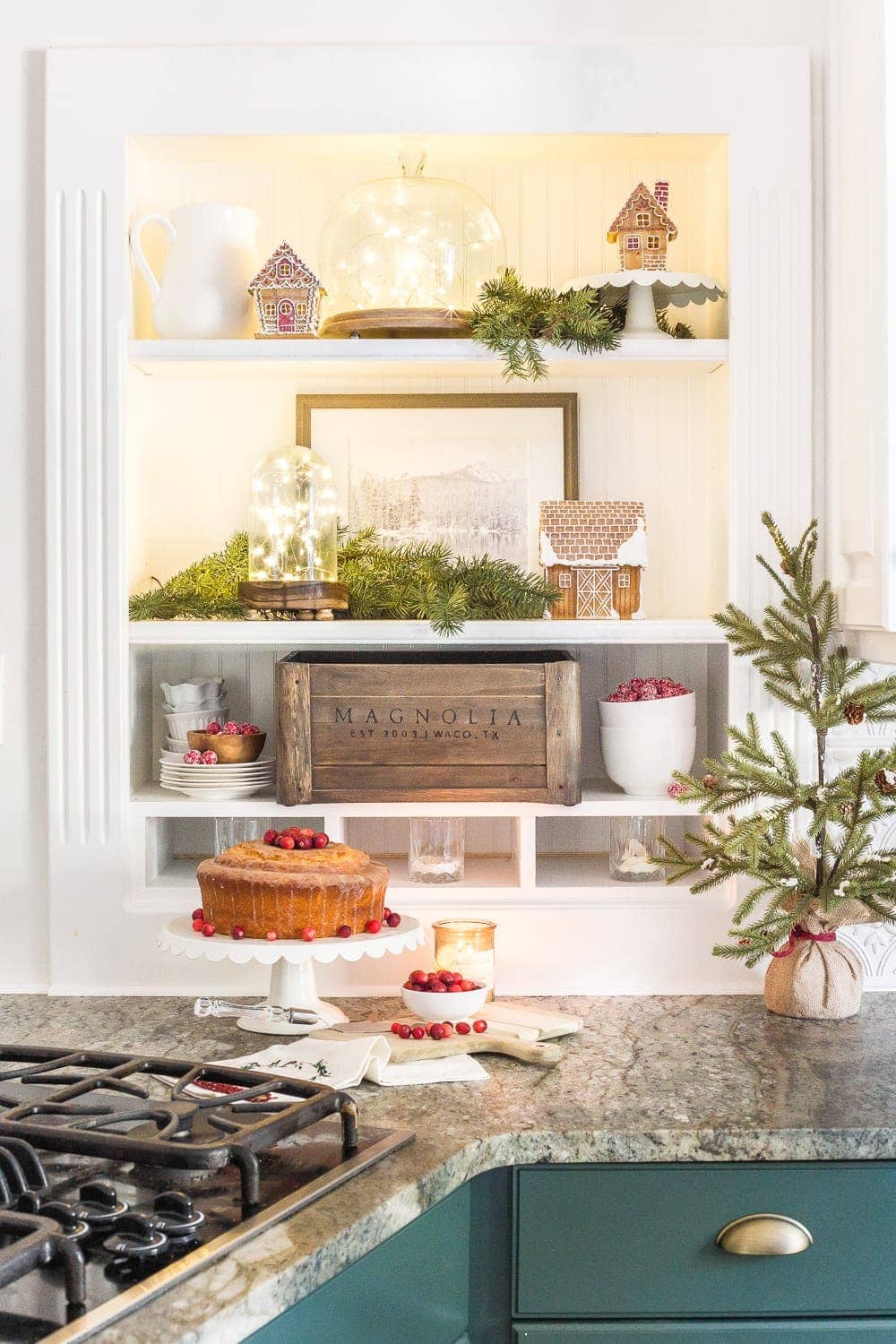 thrift store Christmas decorations with fairy lights under cloches