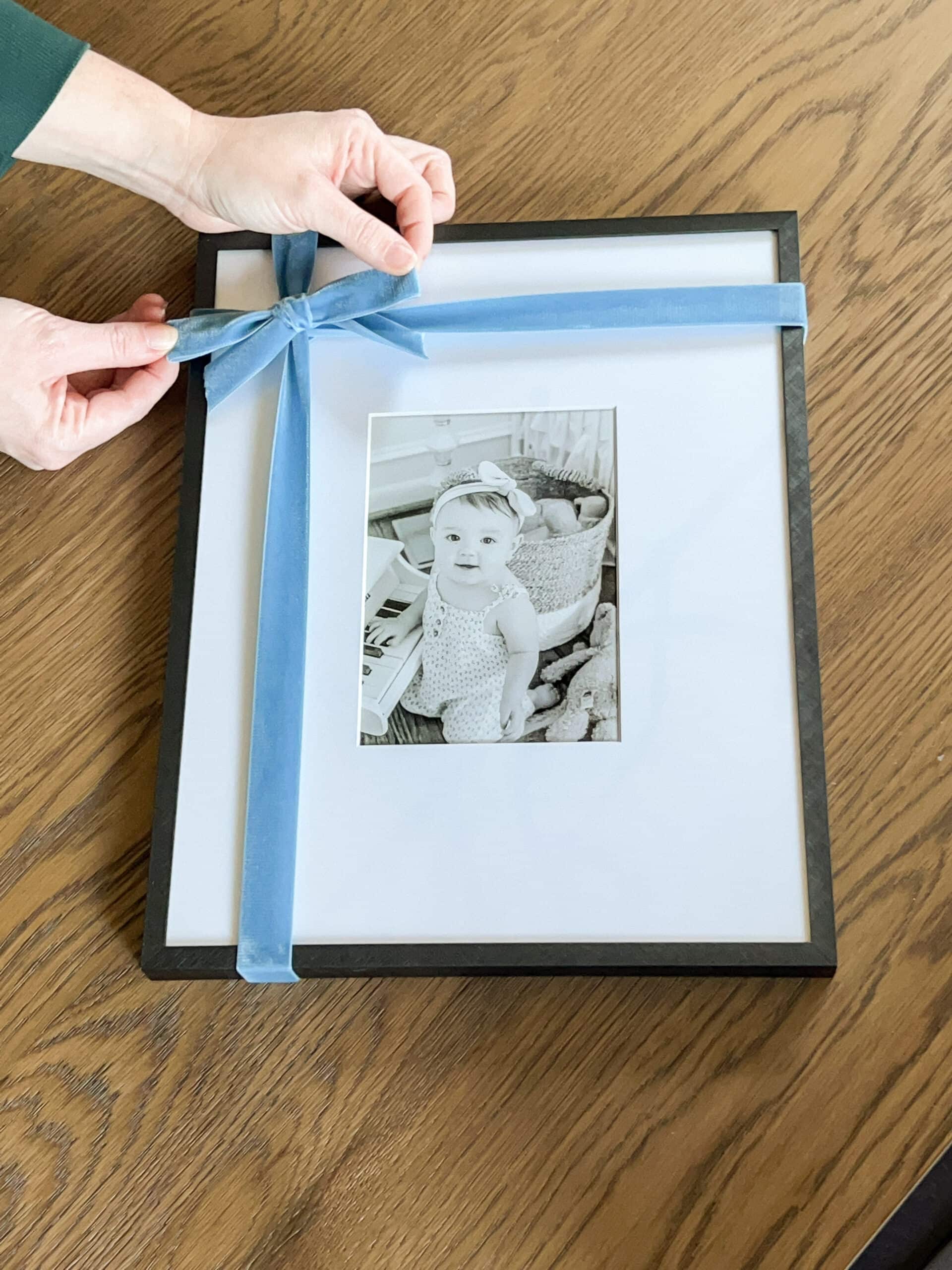 Christmas bow tied onto a picture frame