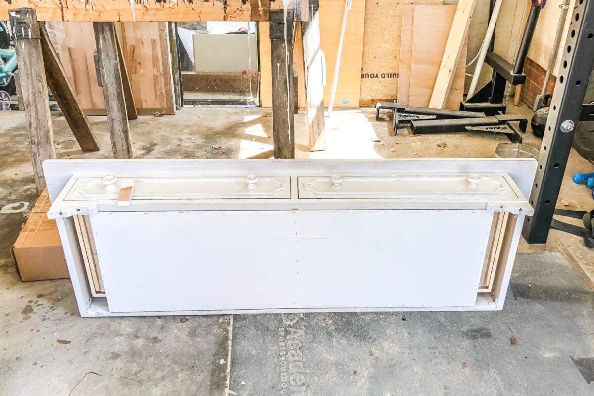 How to Turn a Console Table Into a Bathroom Vanity | blesserhouse.com - A tutorial for how to reconstruct a console table to repurpose as a bathroom vanity and leave drawers functional underneath sinks. 