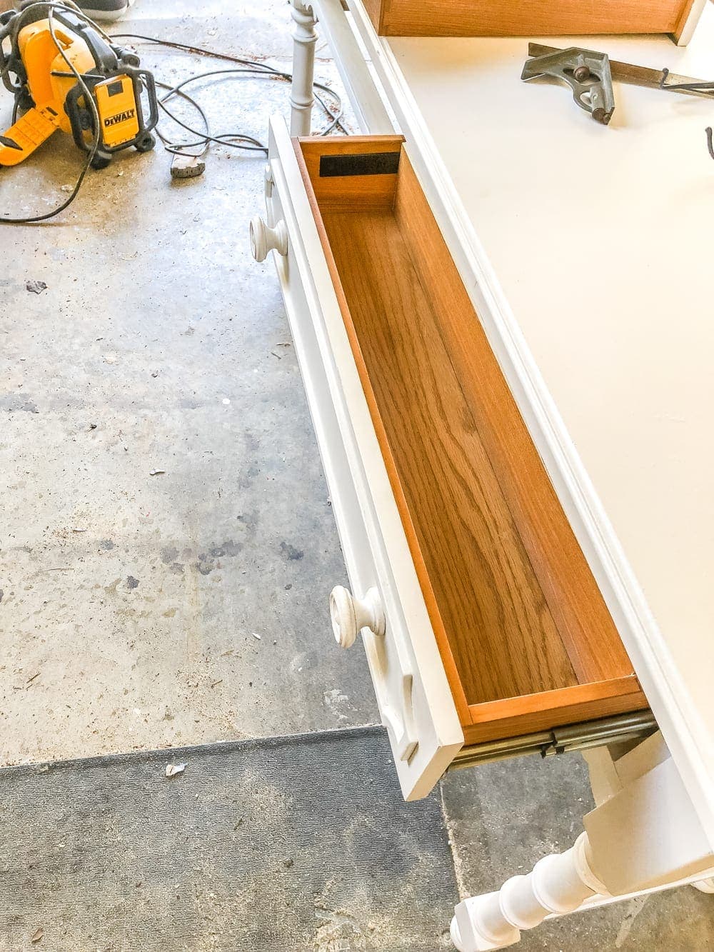 How to Turn a Console Table Into a Bathroom Vanity | blesserhouse.com - A tutorial for how to reconstruct a console table to repurpose as a bathroom vanity and leave drawers functional underneath sinks. 