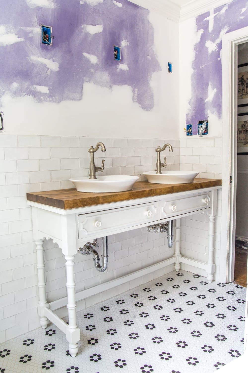 How to Turn a Console Table Into a Bathroom Vanity | blesserhouse.com - A tutorial for how to reconstruct a console table to repurpose as a bathroom vanity and leave drawers functional underneath sinks. 