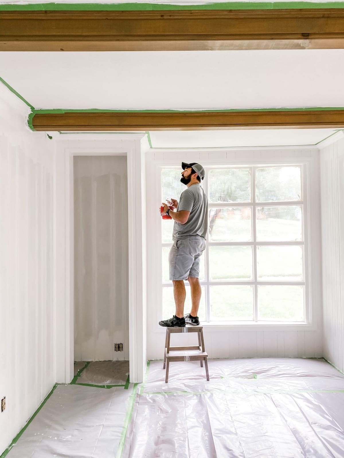 painting wood wall paneling white