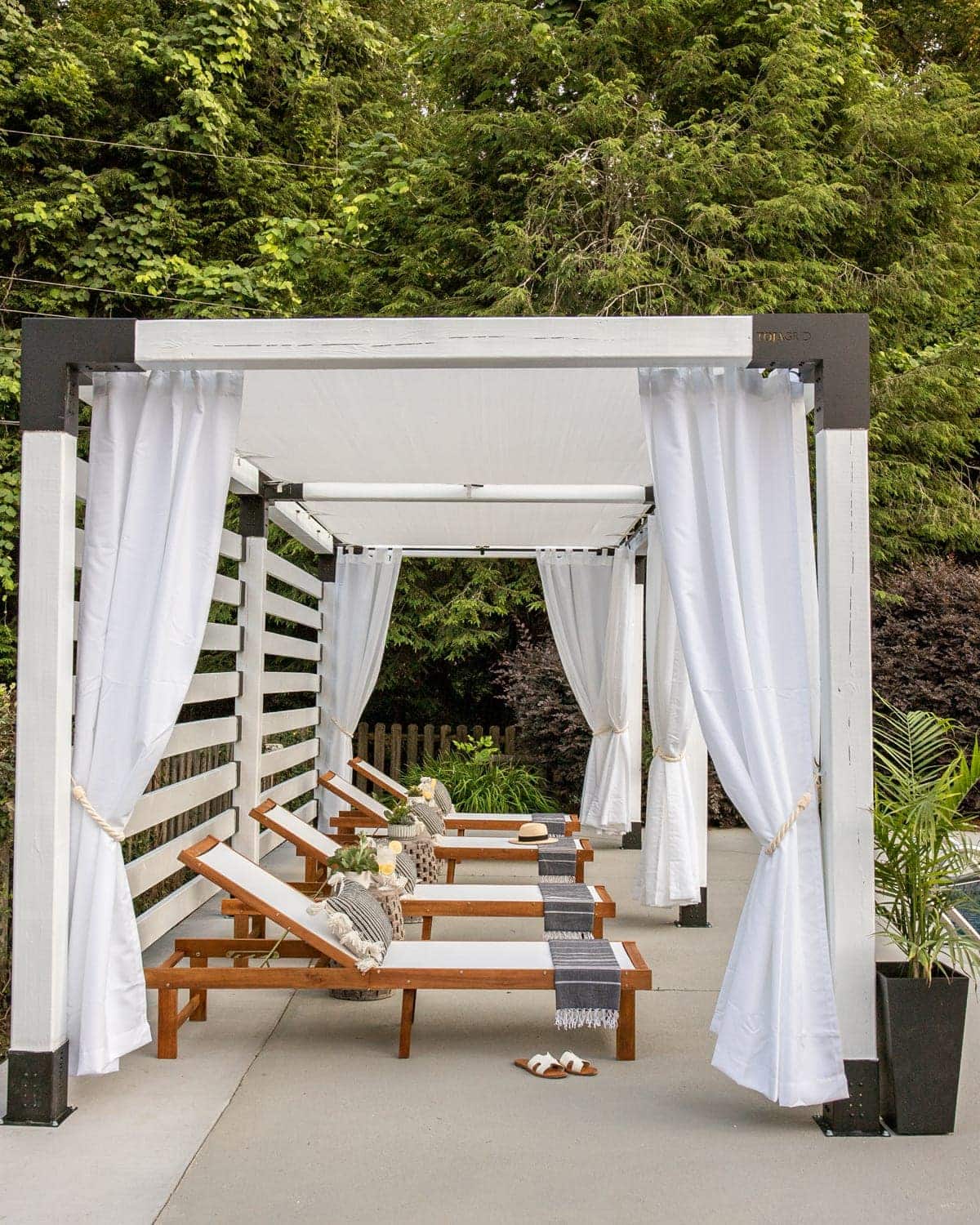 pergola with white outdoor curtains