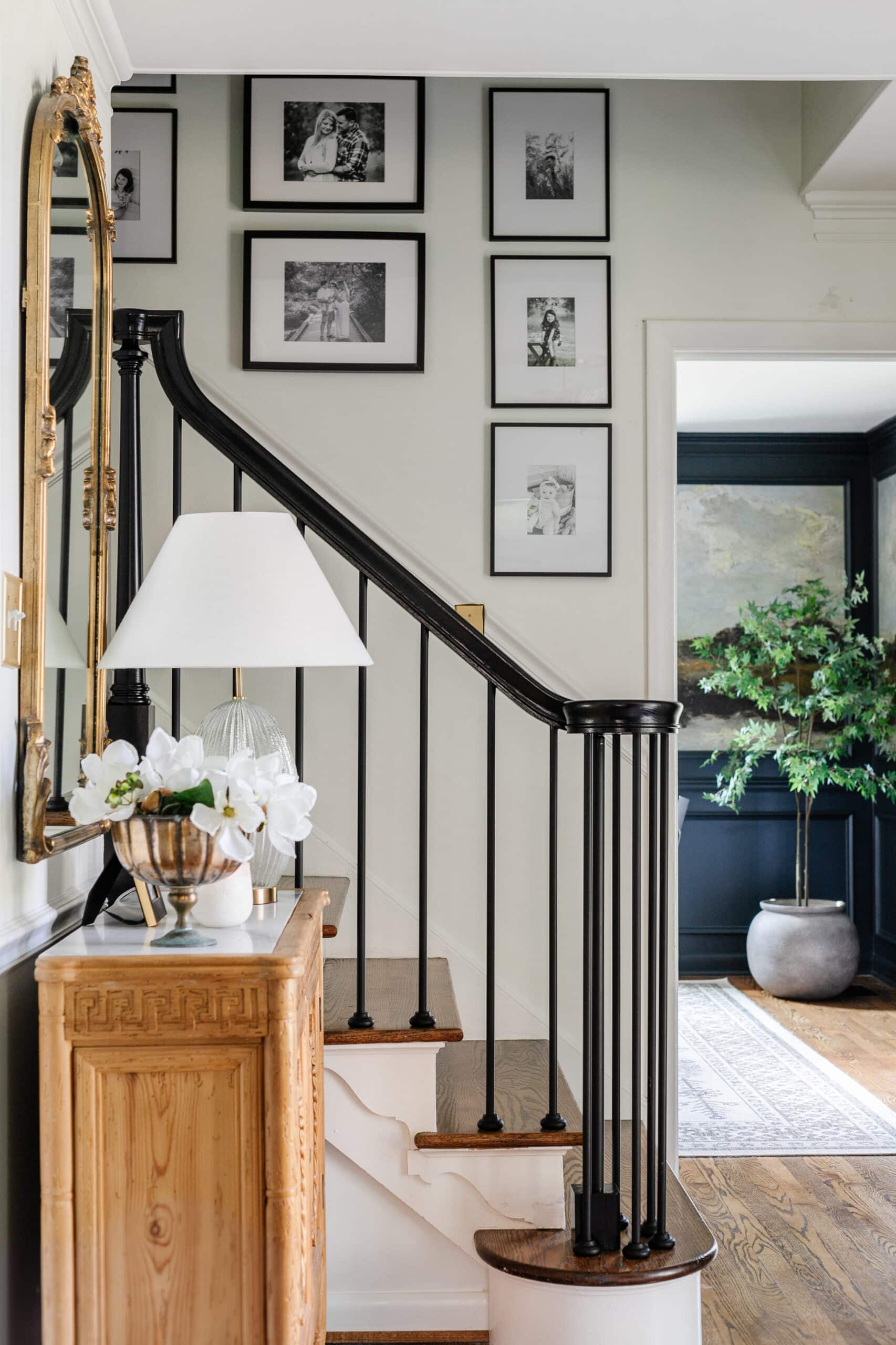 black and white gallery wall going up stairs