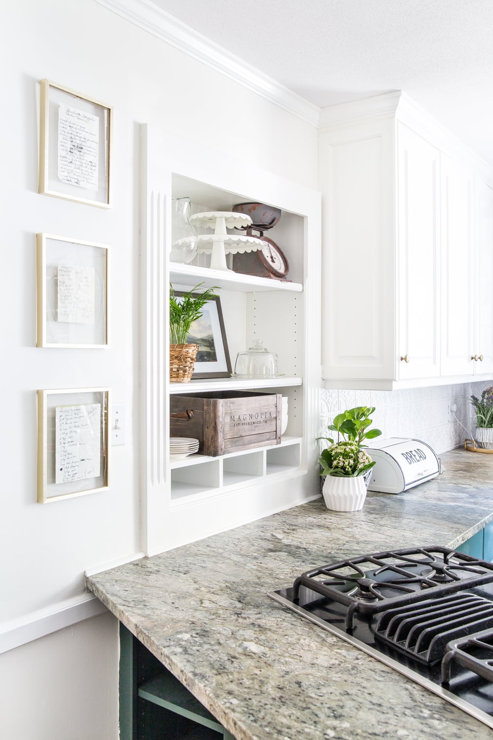 framed handwritten recipes hung on a kitchen wall