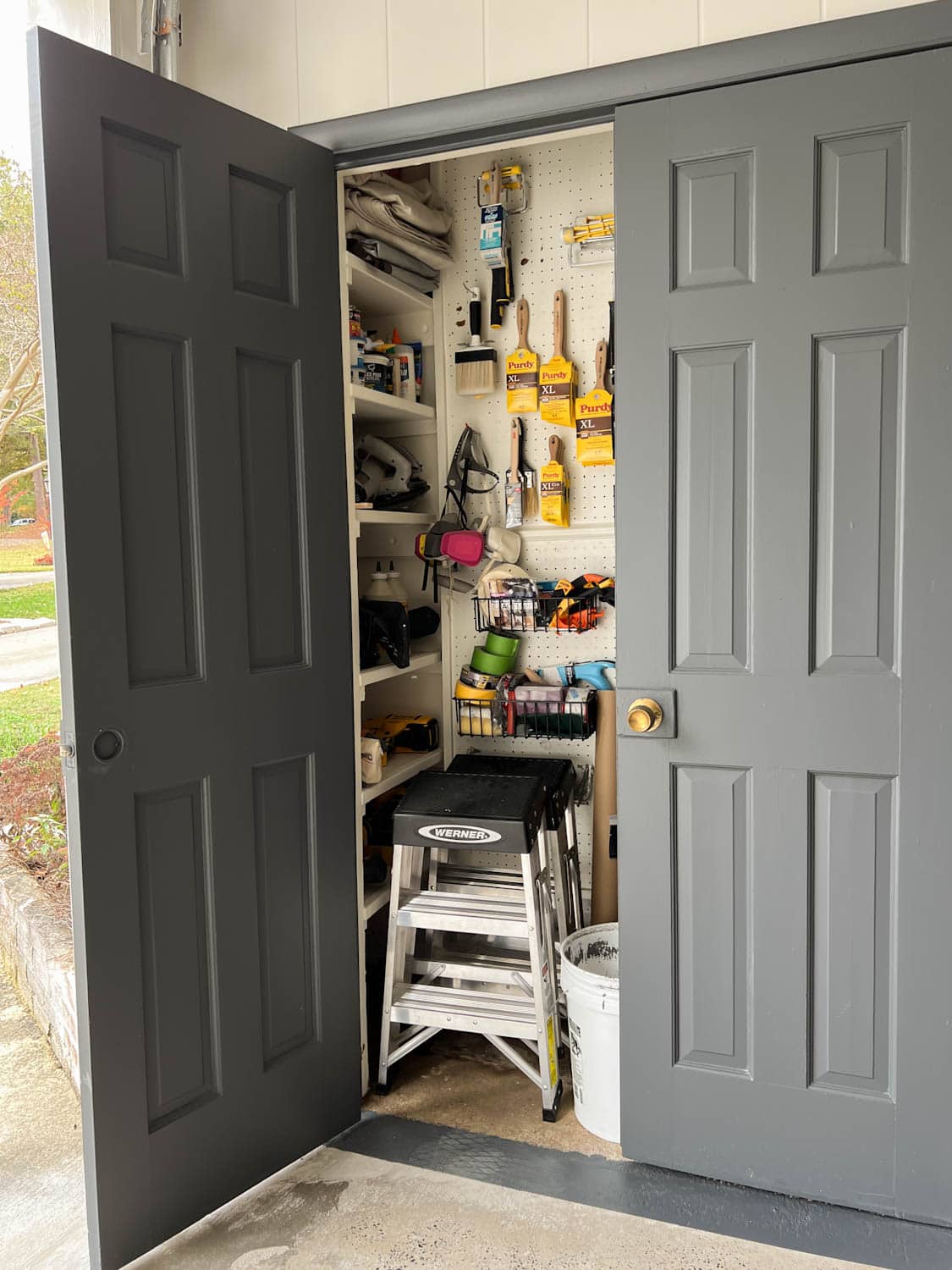 paint storage closet organization using pegboard