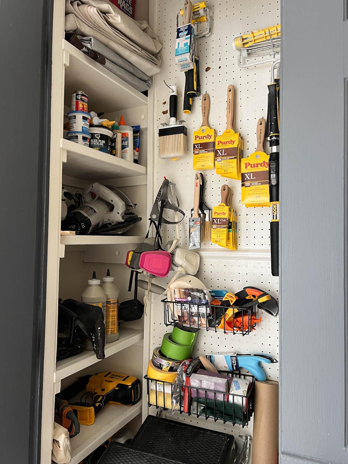 paint storage closet organization using pegboard