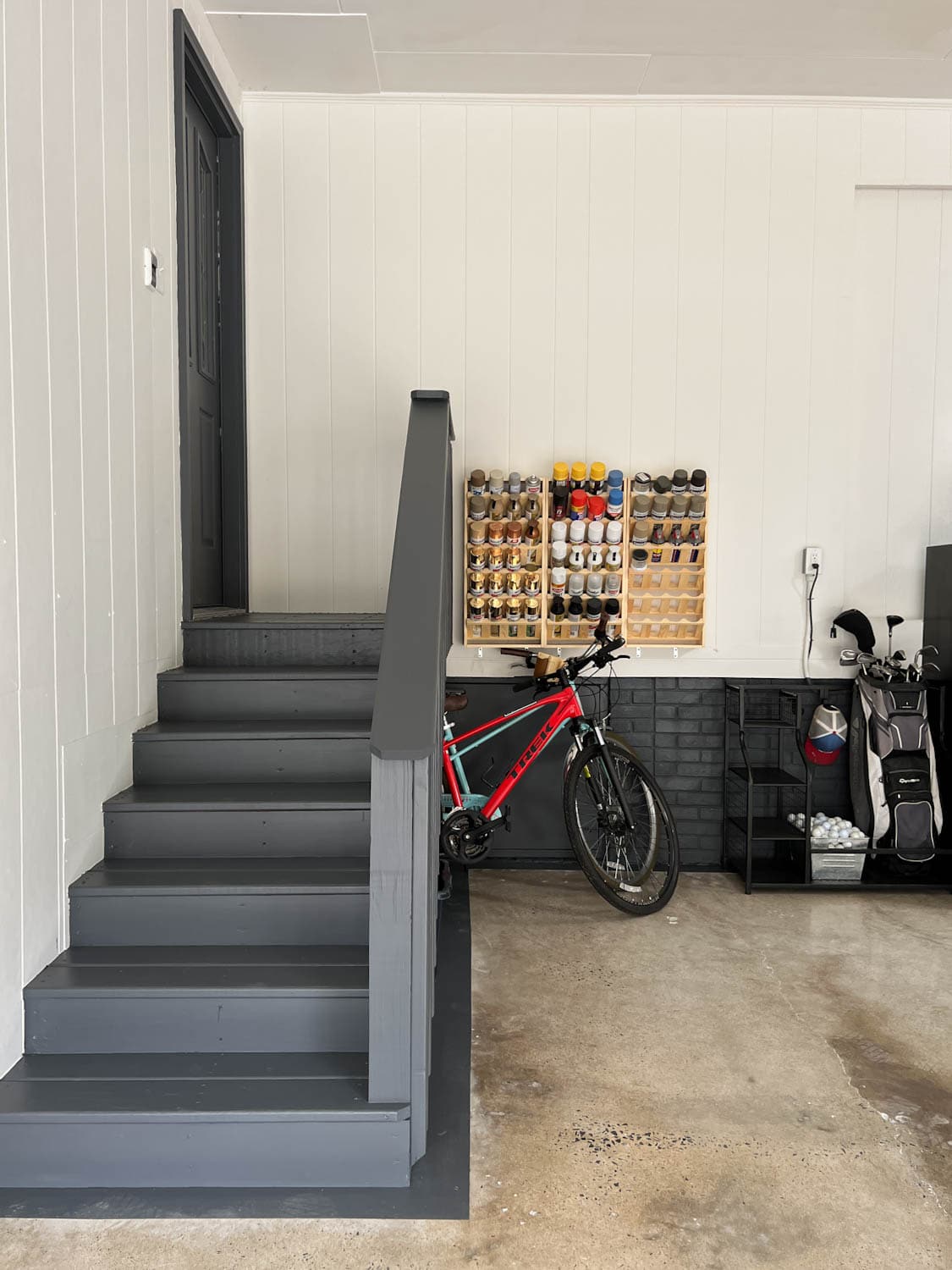 garage makeover with paint can storage and sporting goods storage