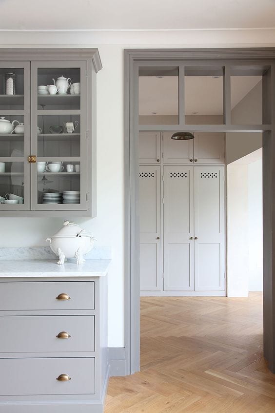 A round-up of taupe and gray trim paint inspirations for a modern-meets-classic look and the best paint colors to pull it off. #graytrim #taupetrim