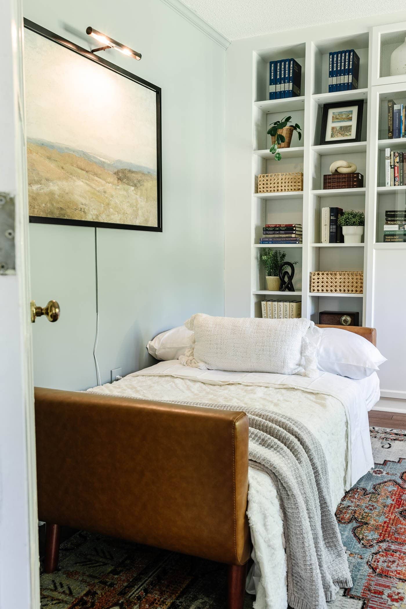 office converted into guest bedroom using a futon