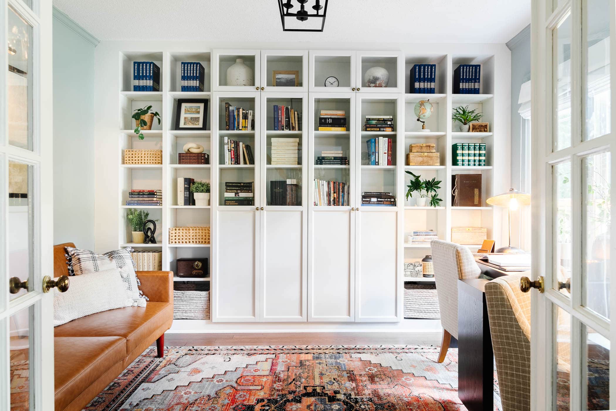 home office with IKEA Billy bookcase hack built in bookshelves for storage
