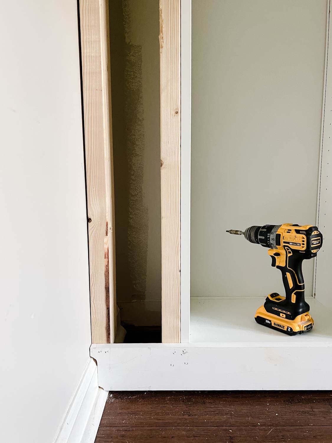 1x4 board cut to the shape of a baseboard to make it look flush against the wall
