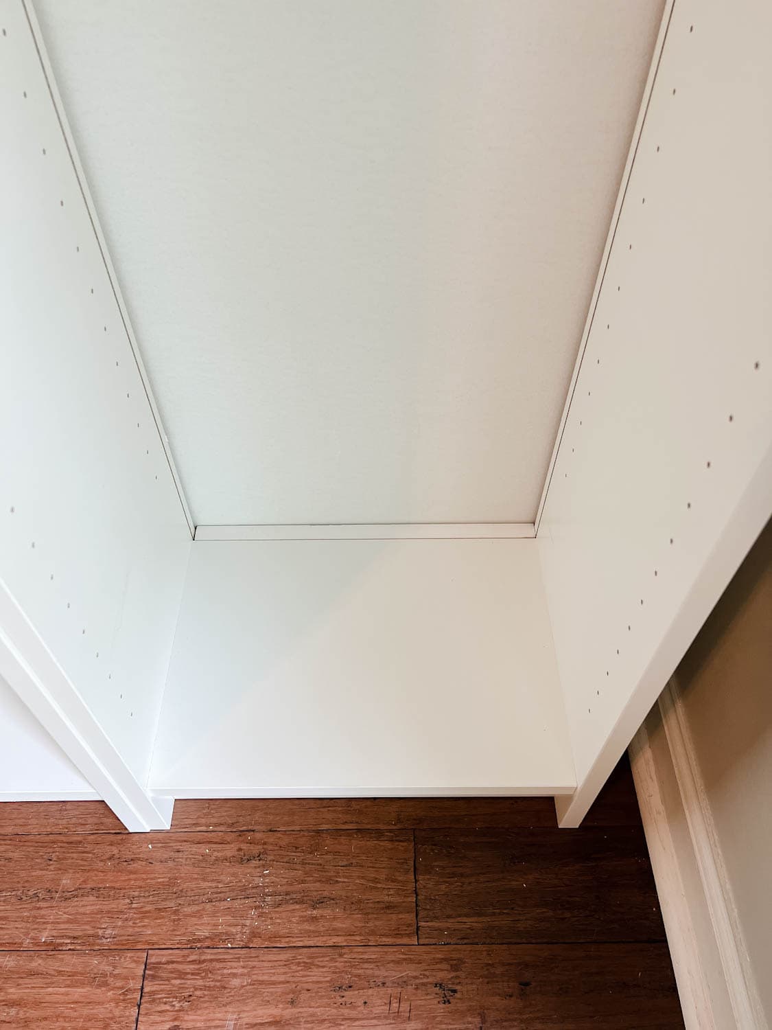 filled gap at the back of a bookcase using a 1x2 to make the IKEA Billy bookcase hack