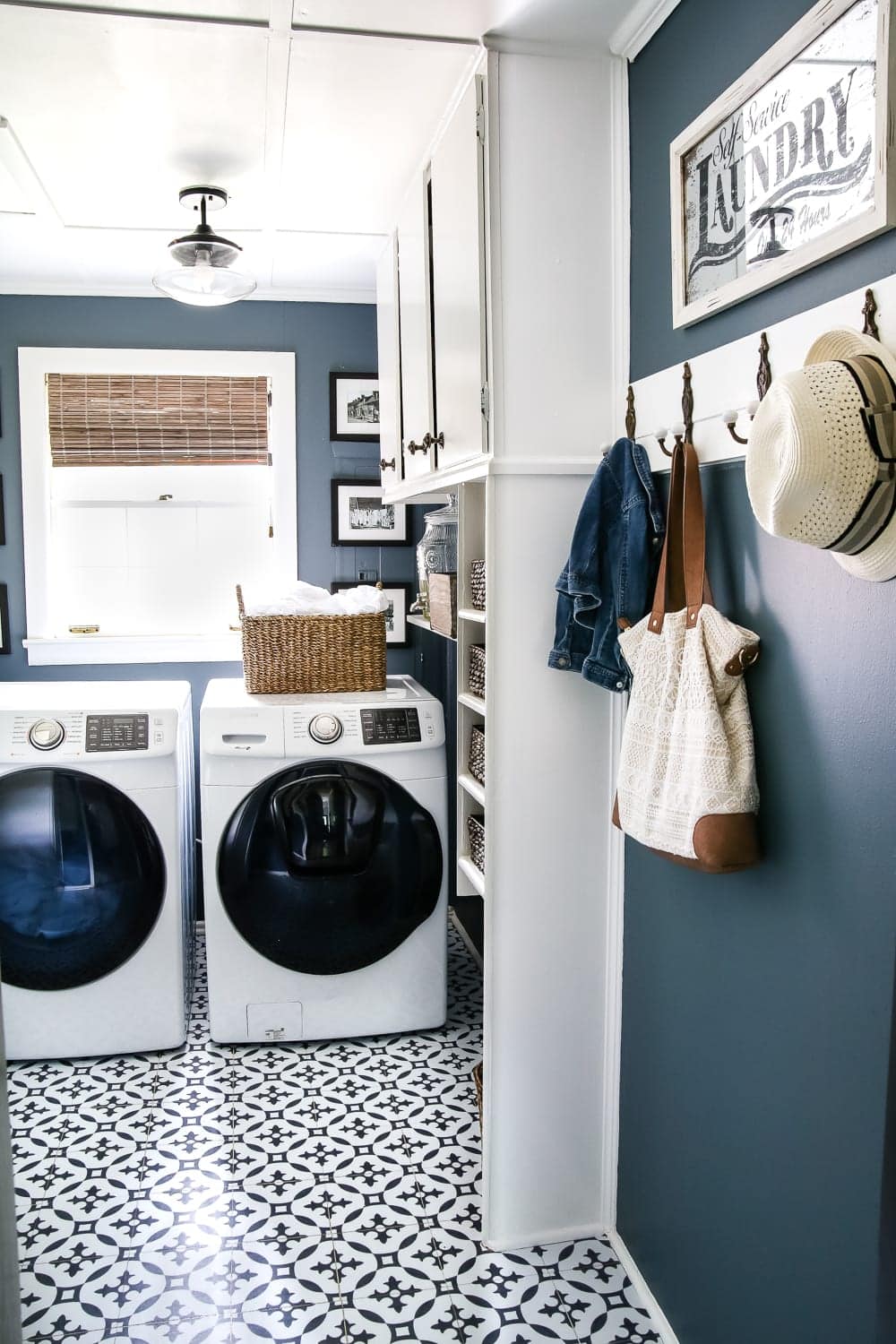 Paint your breaker box the same color as your wall and place magnetic frames on top for easy removal.