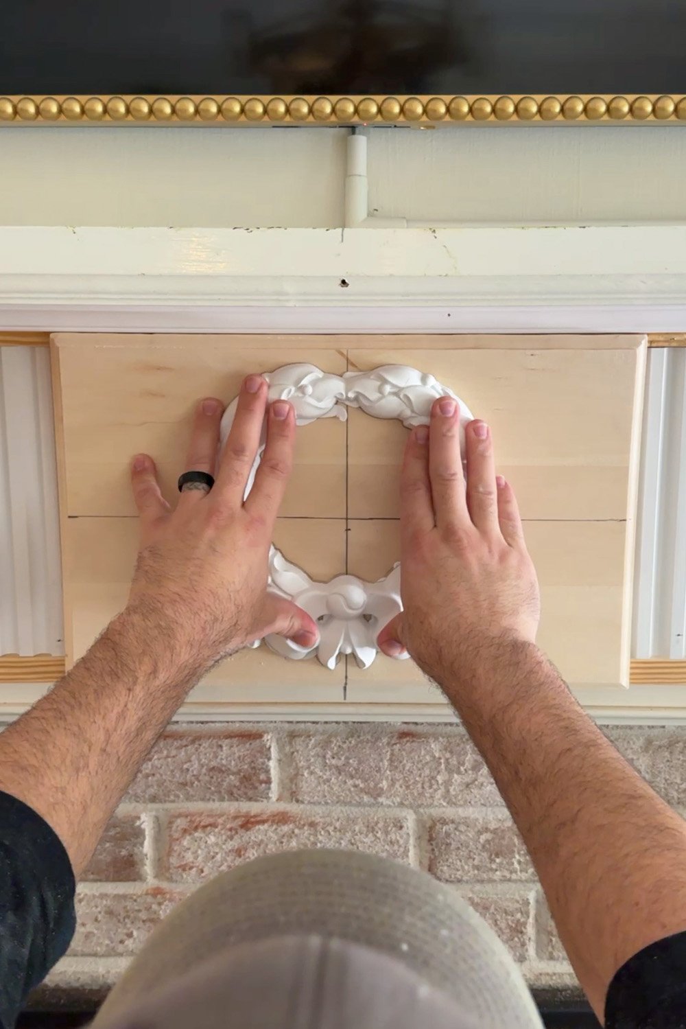 attaching wreath overlay with construction adhesive
