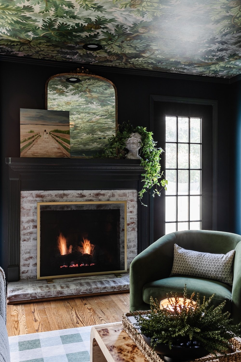 modern traditional media room fireplace with limewashed brick and swivel chair