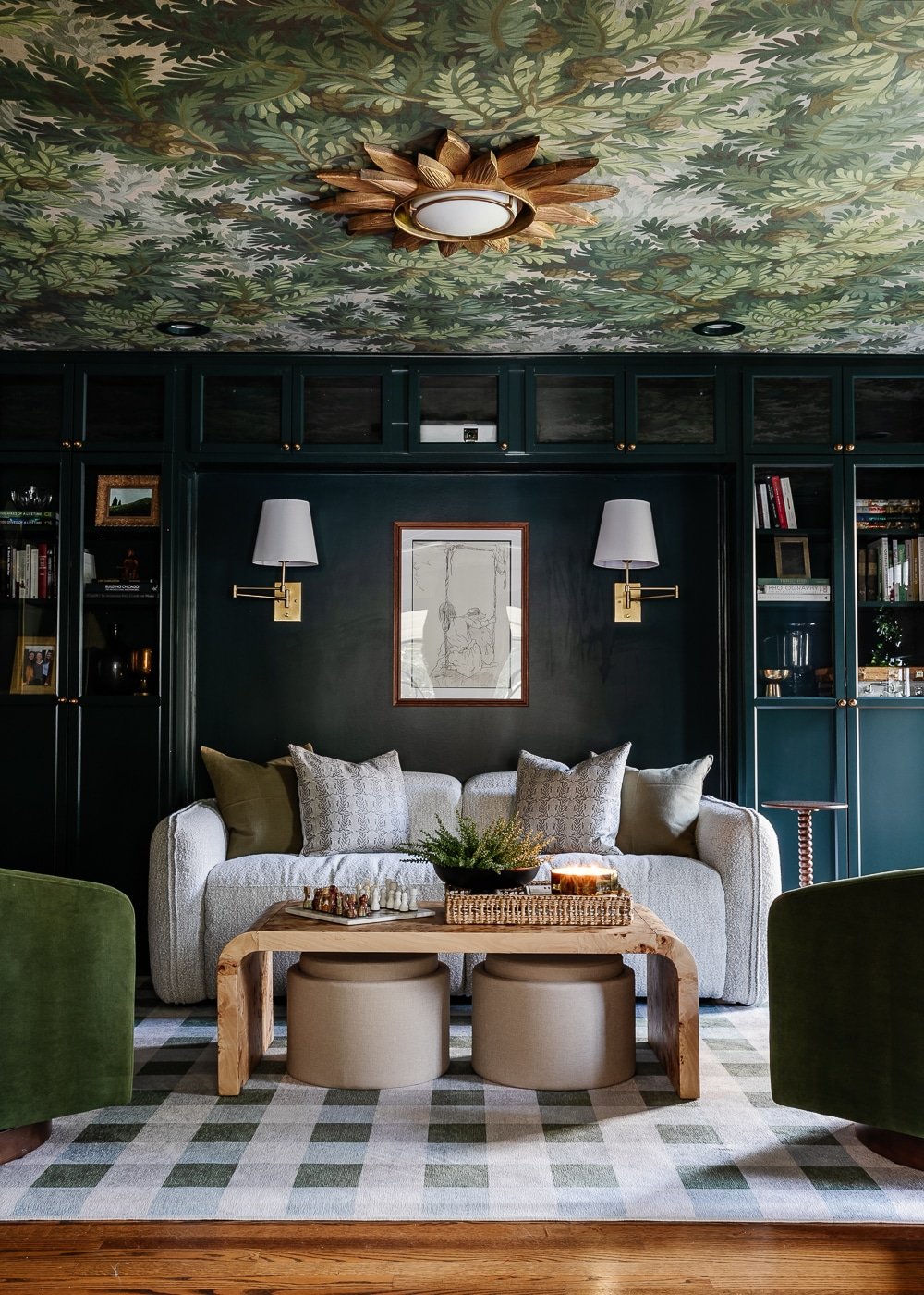 media room bookcases painted Sherwin Williams Cascades with Rebel Walls Spruce Forest wallpaper ceiling and gingham washable Ruggable rug