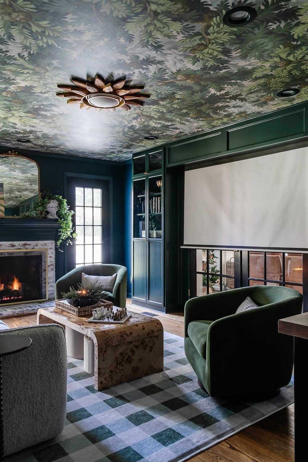 hidden movie screen above French doors in a diy home theater room