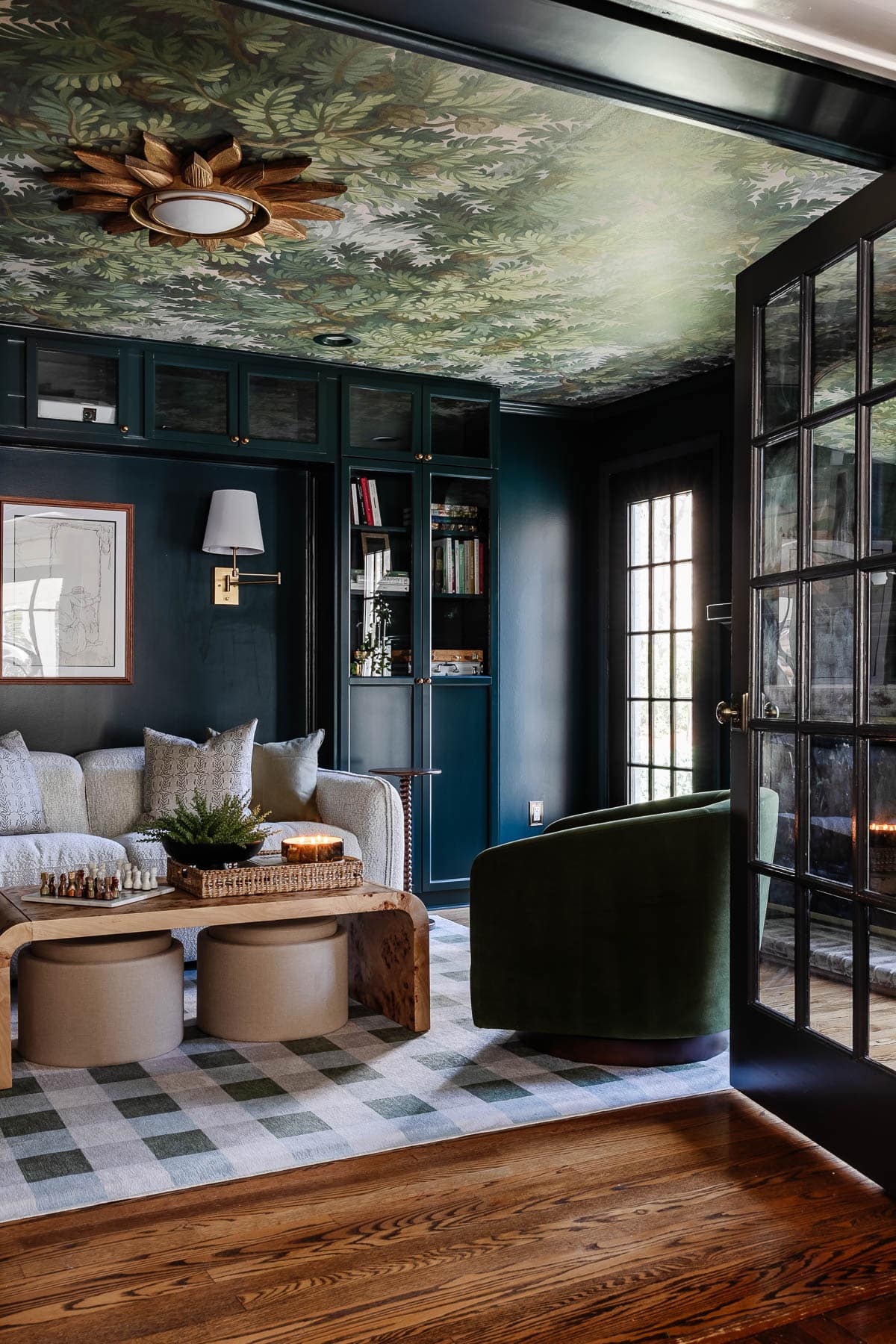 media room makeover with built in bookshelves French doors and fireplace