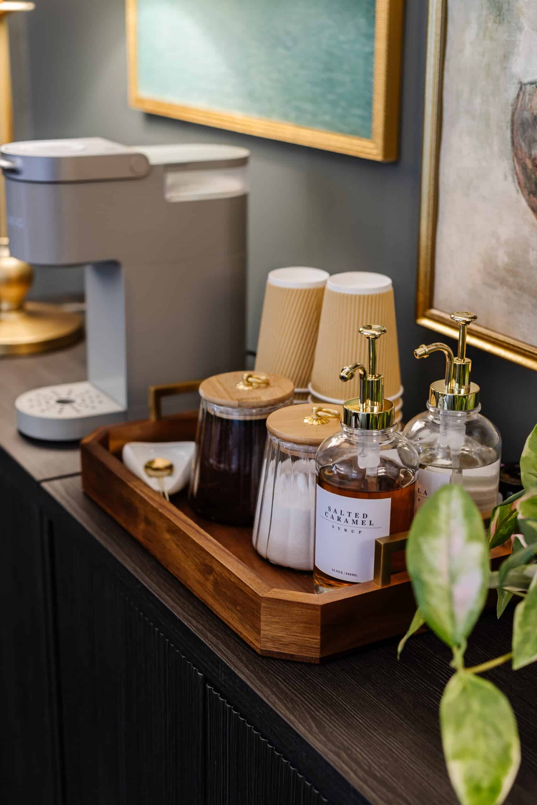 office coffee station with syrup dispensers and coffee canisters