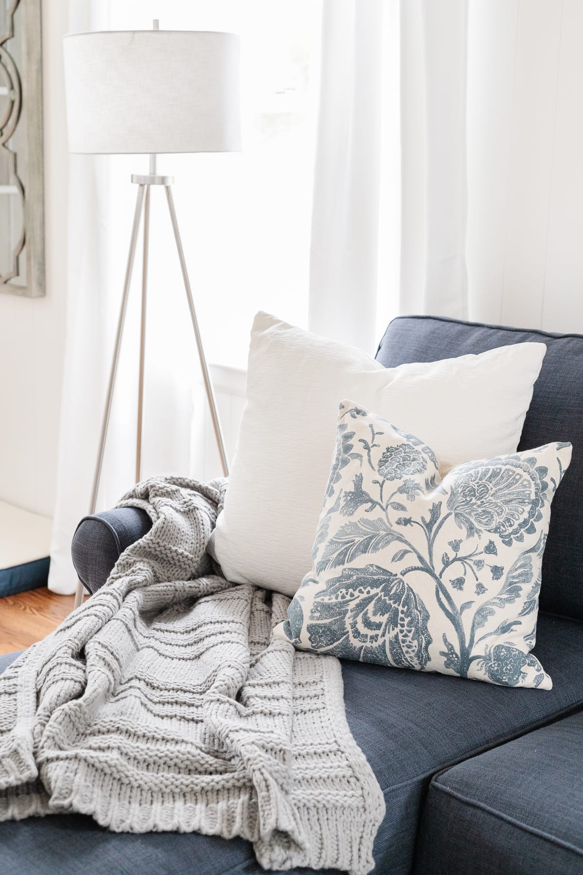 coastal style living room sofa with throw pillows