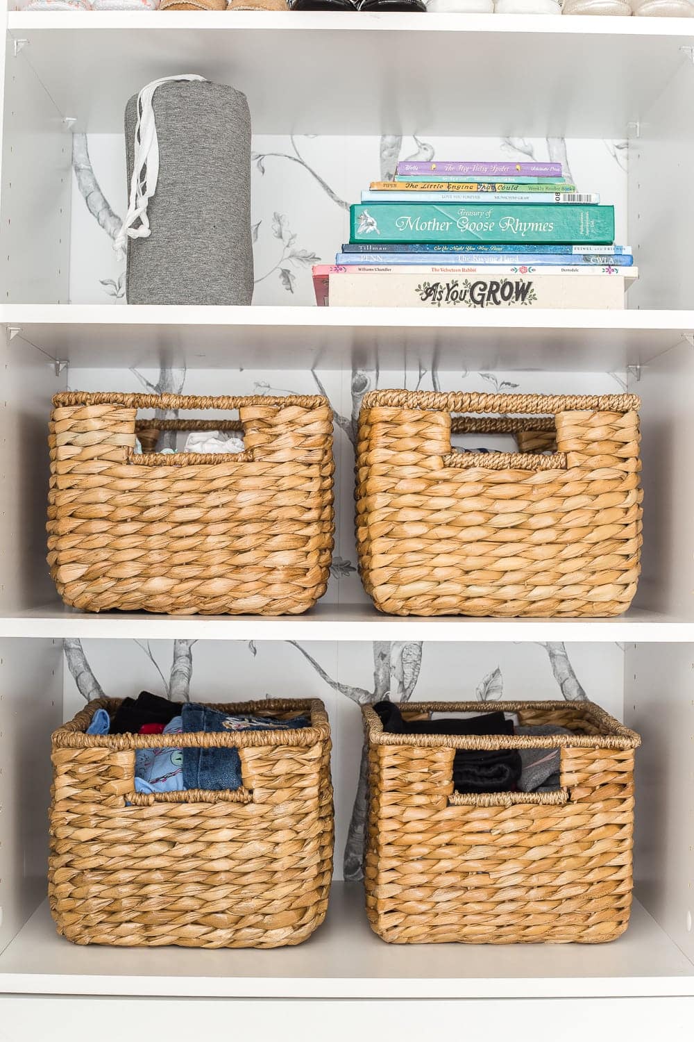Nursery Organization | Closet shelves to hold next phase size clothing and baby books for story time.