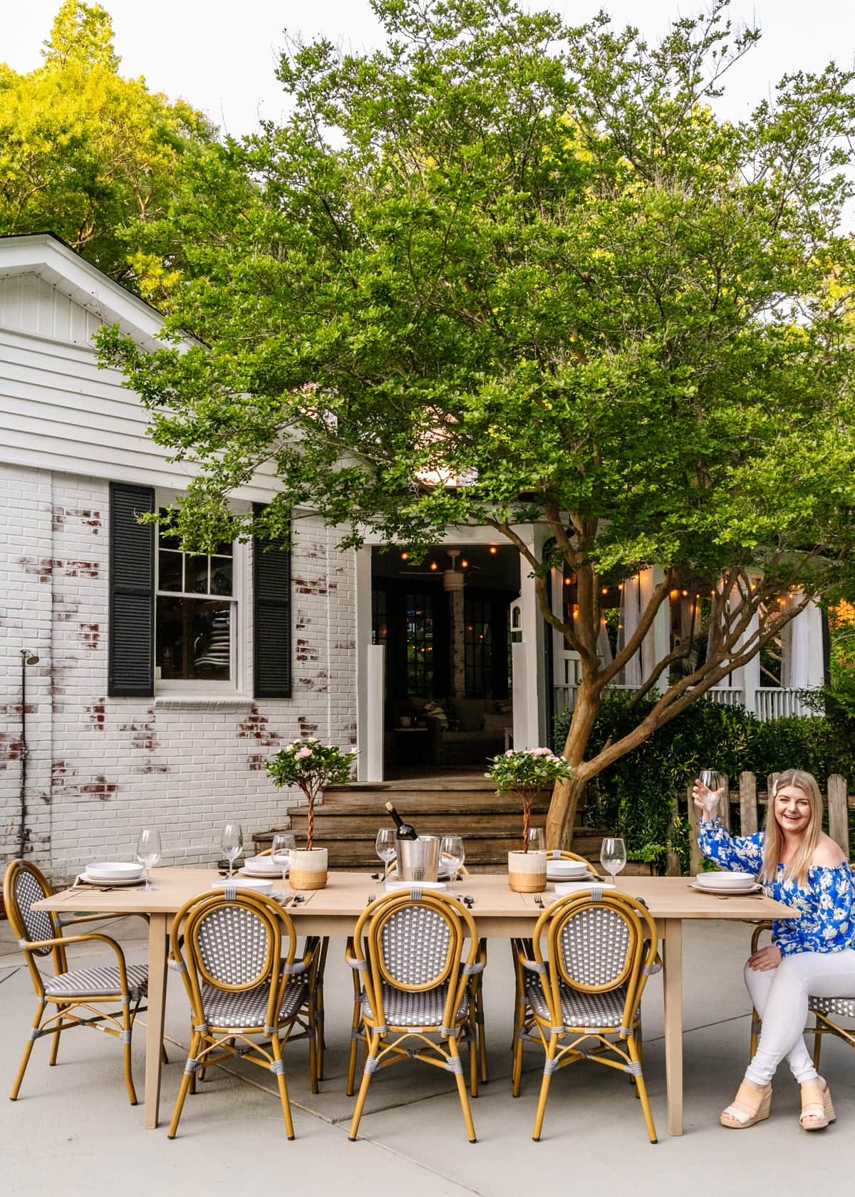 outdoor dining table painted like driftwood on a patio
