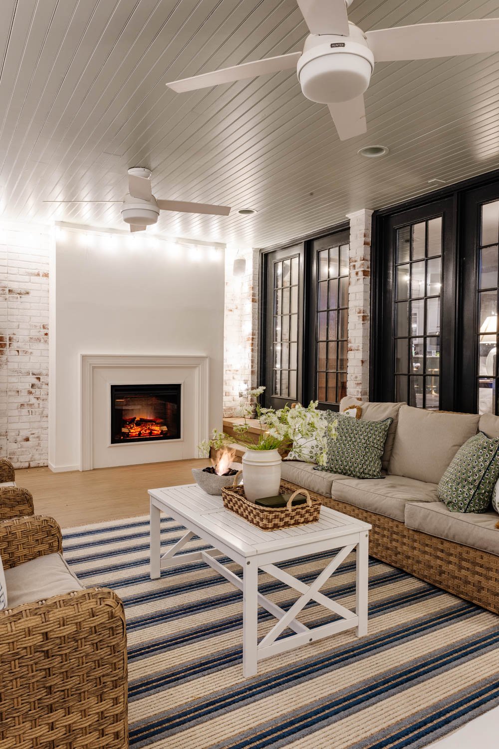 outdoor living room with fireplace on a back porch