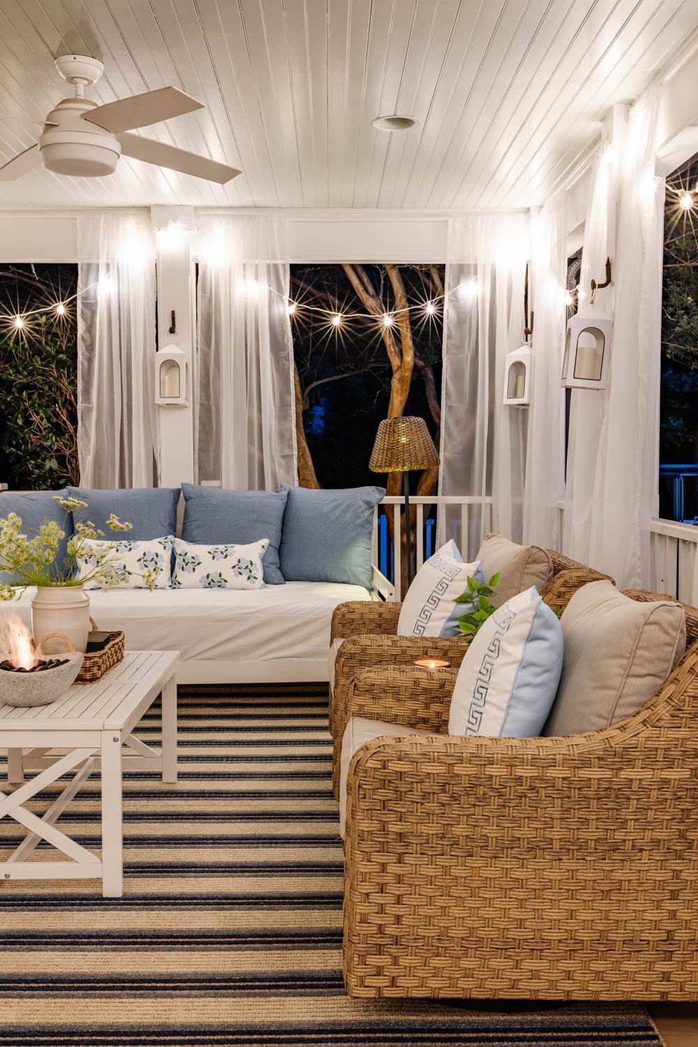 outdoor living room with fireplace on a back porch