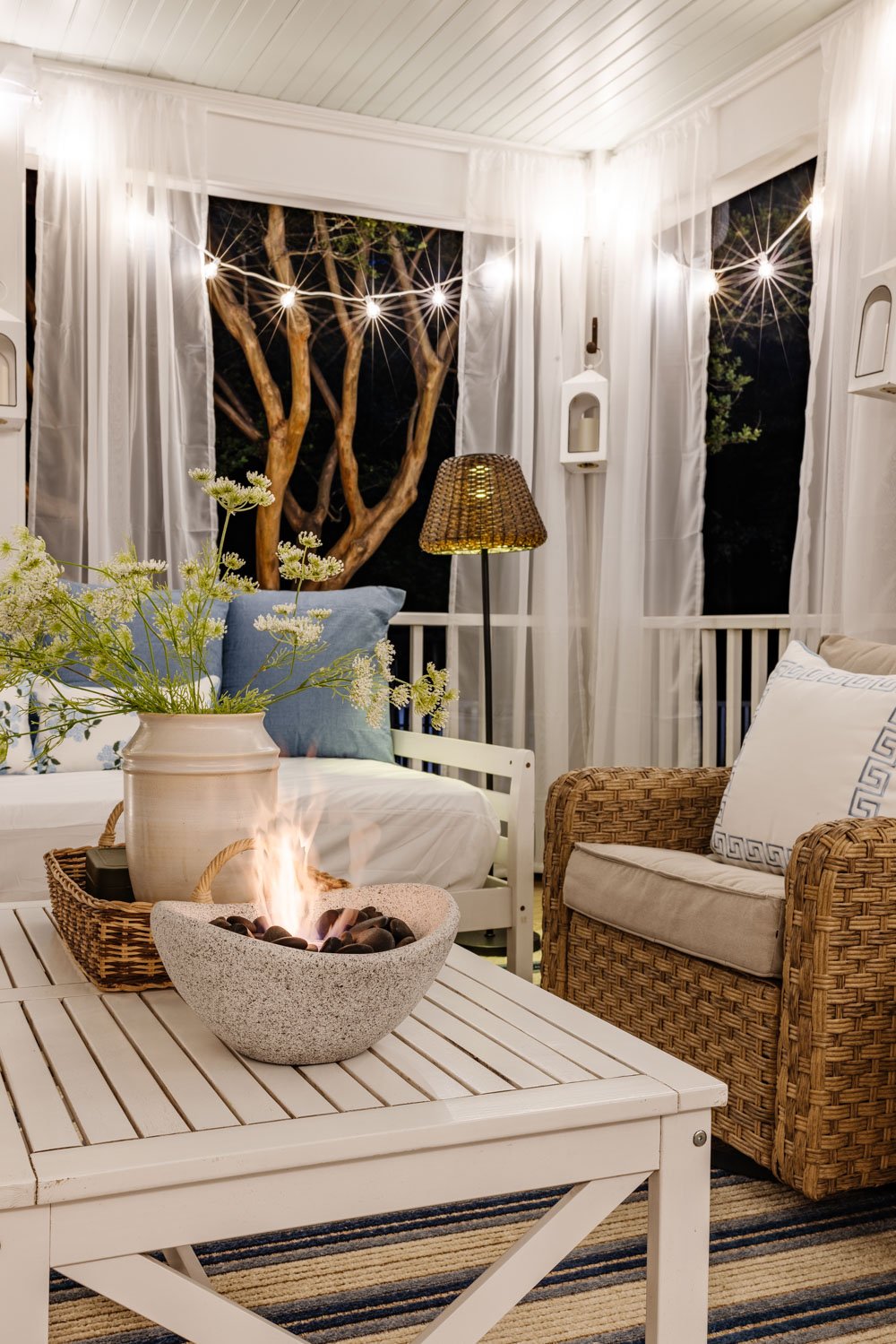 outdoor living room with fireplace on a back porch