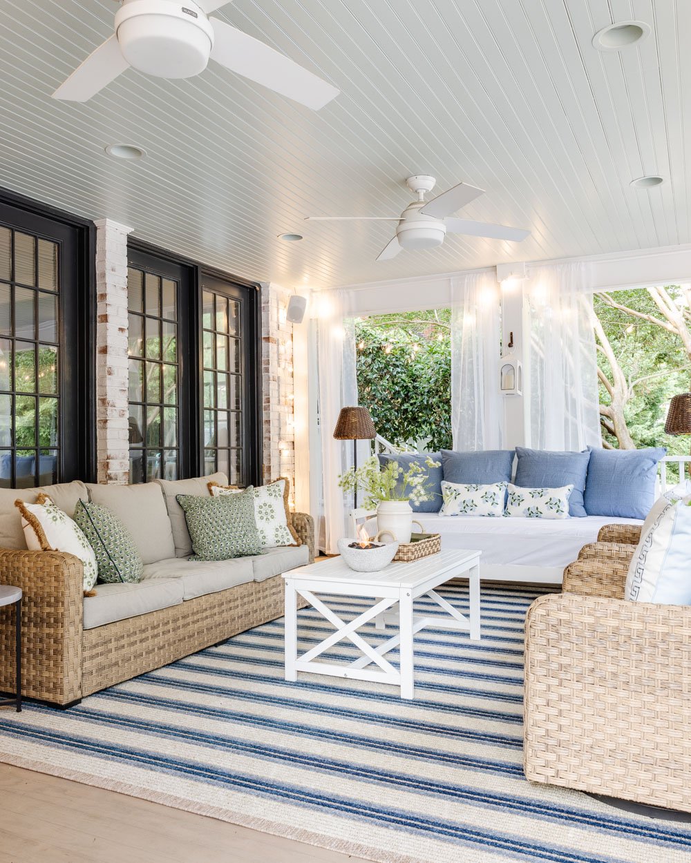 outdoor living room with fireplace on a back porch
