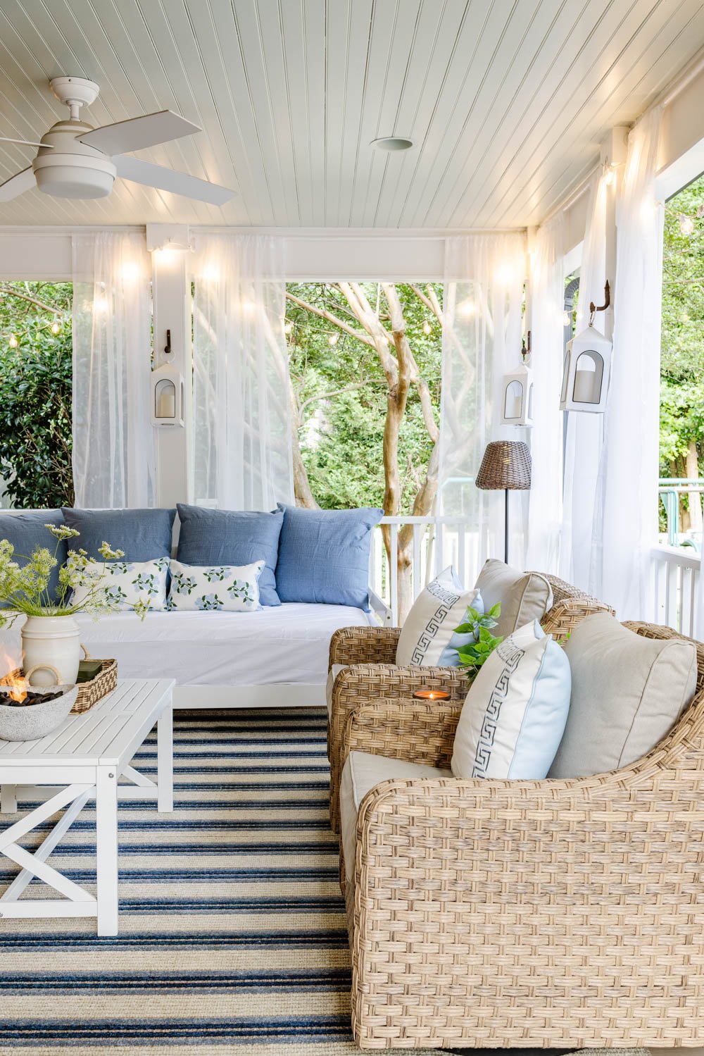 outdoor living room with fireplace on a back porch