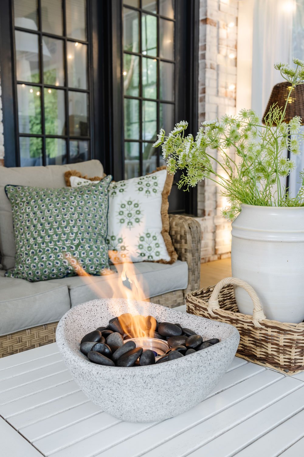 outdoor living room with fireplace on a back porch