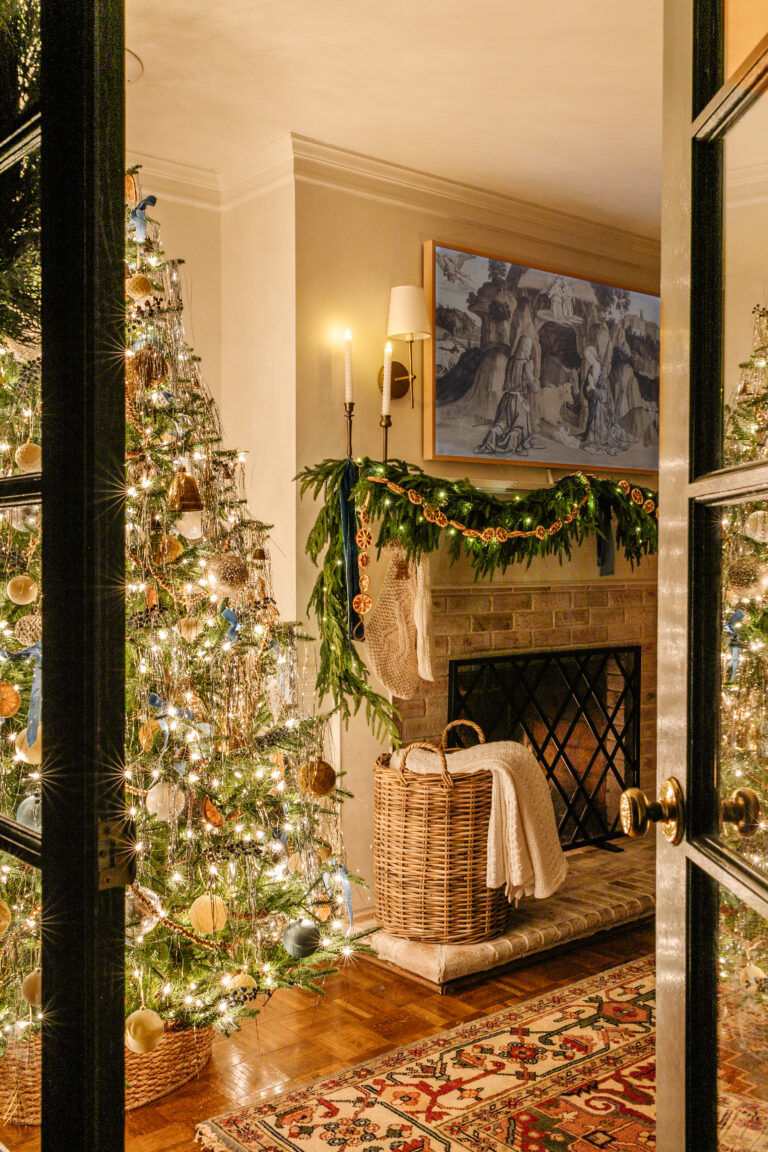 christmas tree lights at night beside fireplace