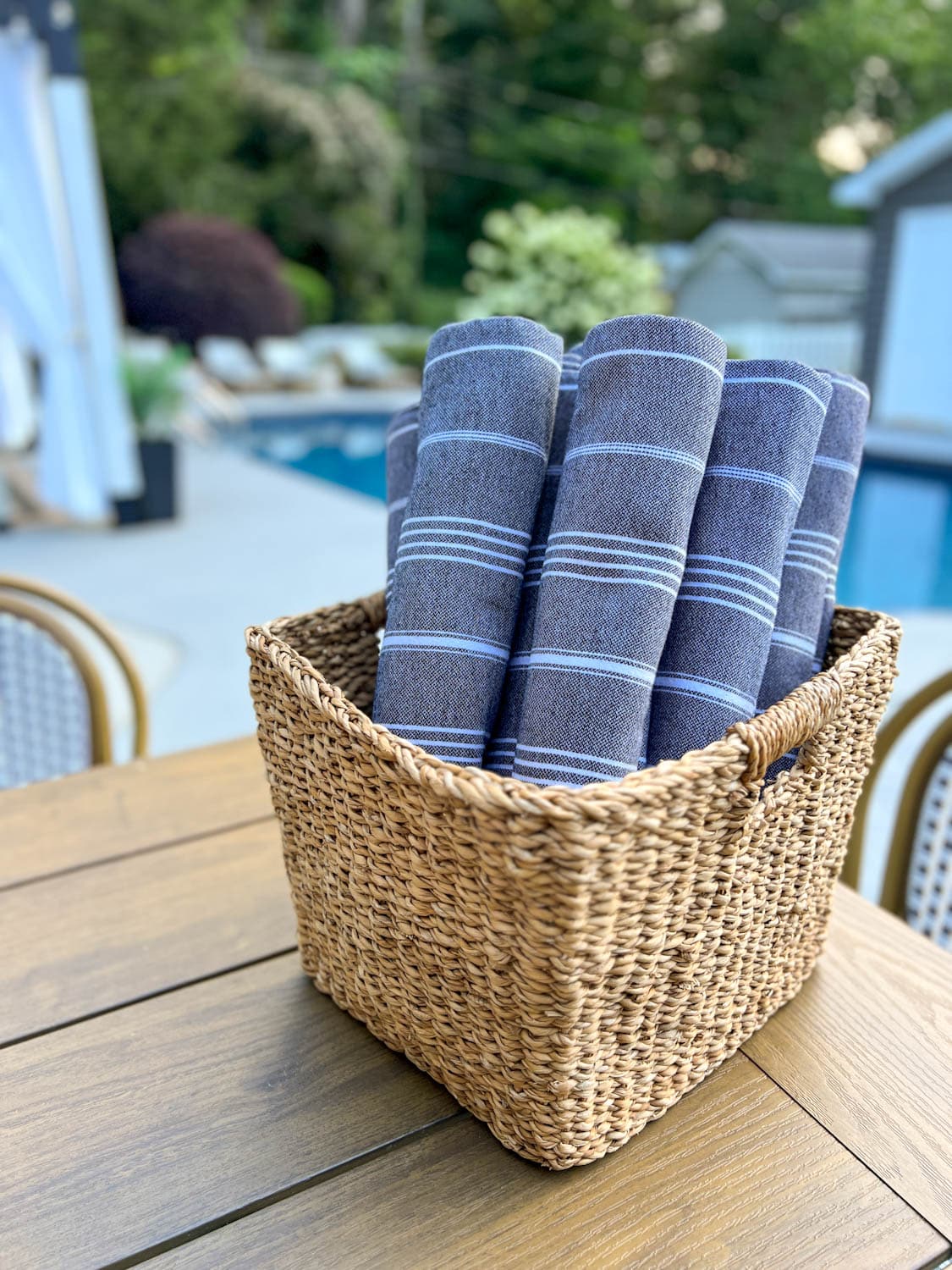 backyard pool towels in a basket for guests to use