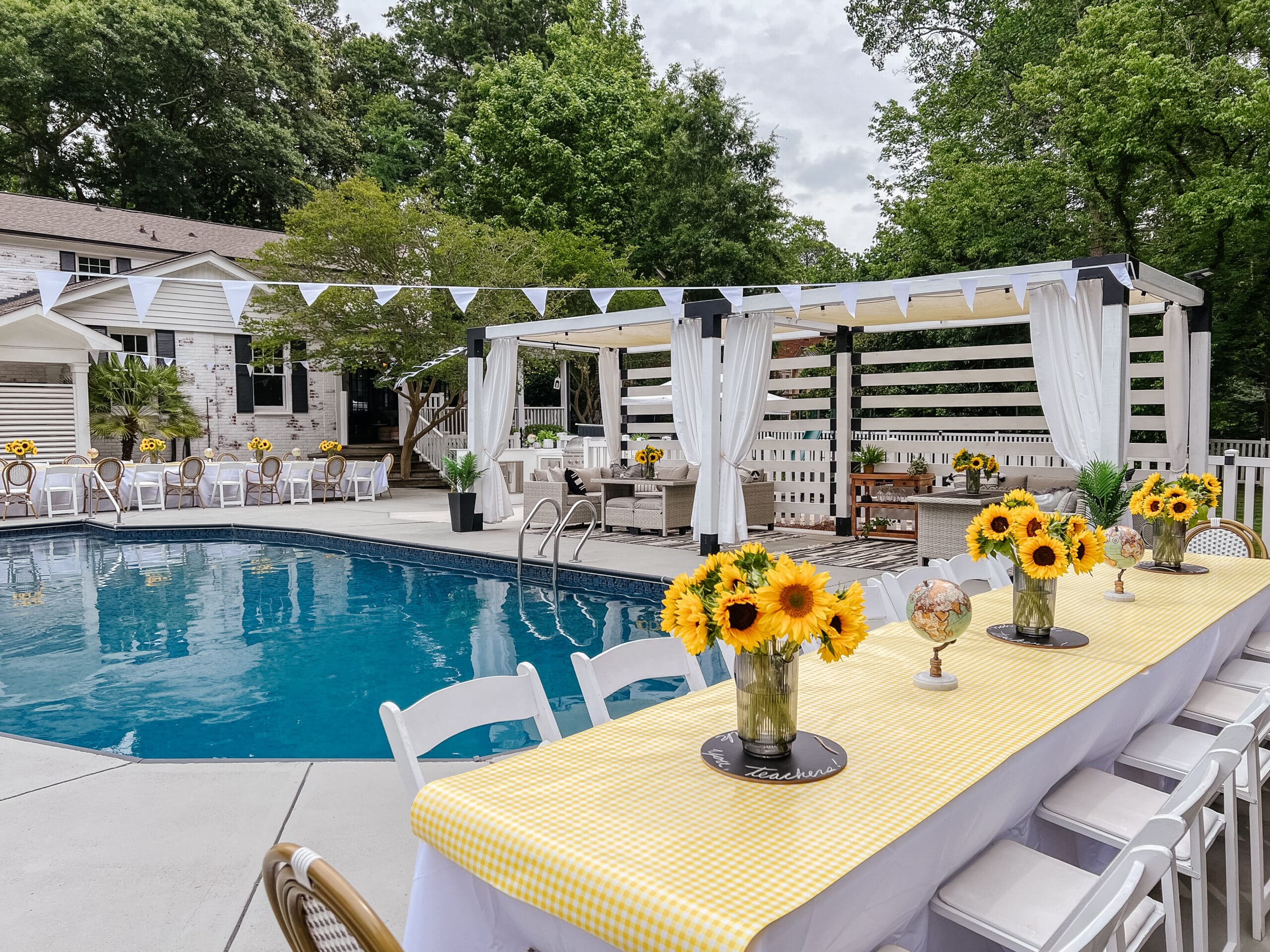 sunny days ahead end-of-school-year / graduation party with sunflowers around a backyard pool
