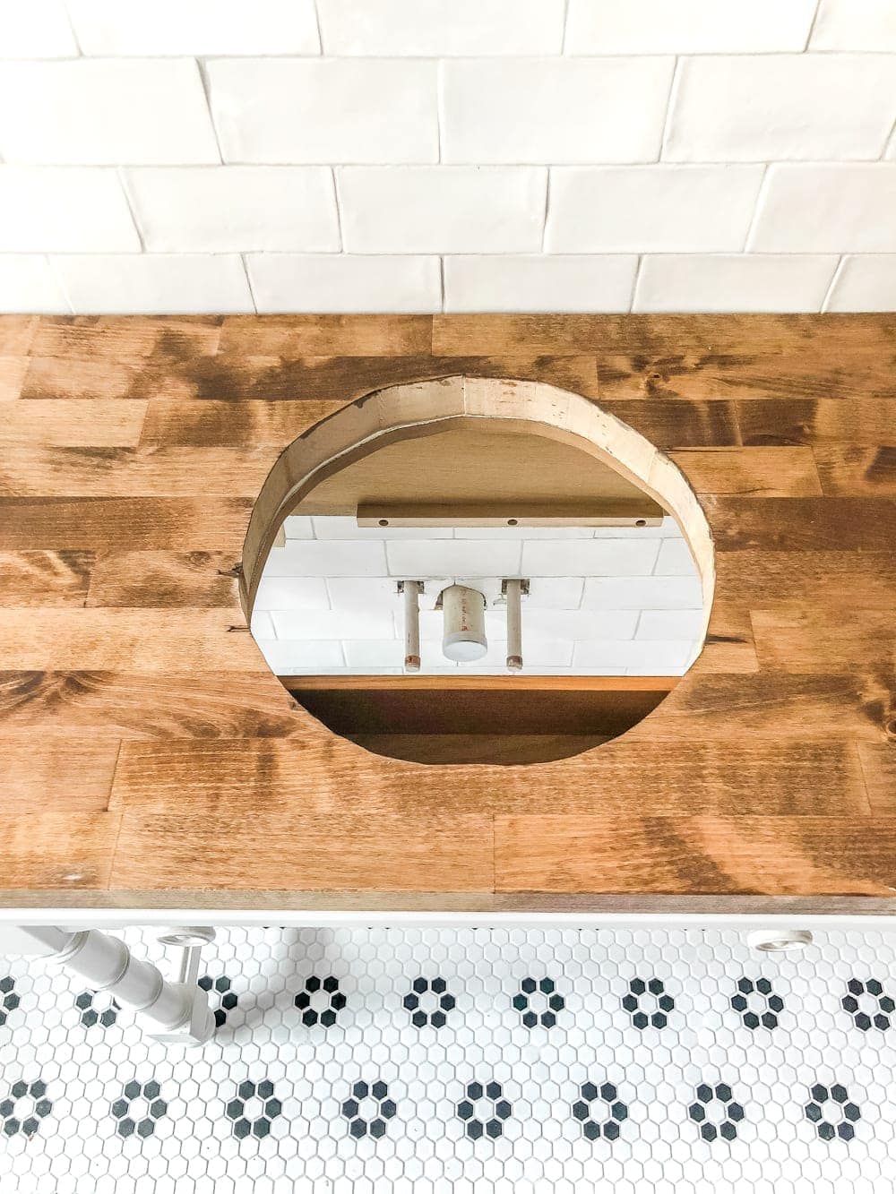 How to Turn a Console Table Into a Bathroom Vanity | blesserhouse.com - A tutorial for how to reconstruct a console table to repurpose as a bathroom vanity and leave drawers functional underneath sinks. 