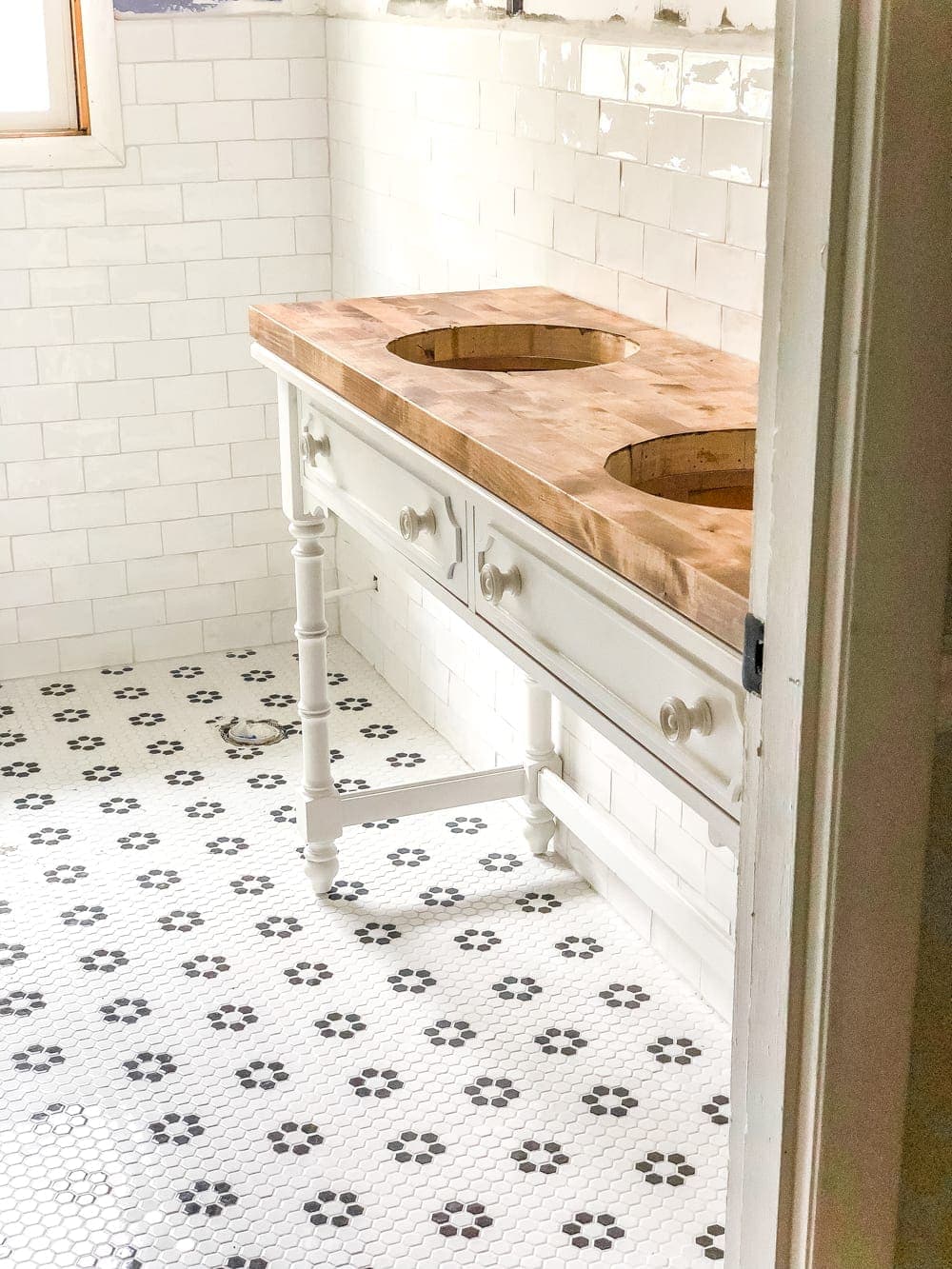 How to Turn a Console Table Into a Bathroom Vanity | blesserhouse.com - A tutorial for how to reconstruct a console table to repurpose as a bathroom vanity and leave drawers functional underneath sinks. 