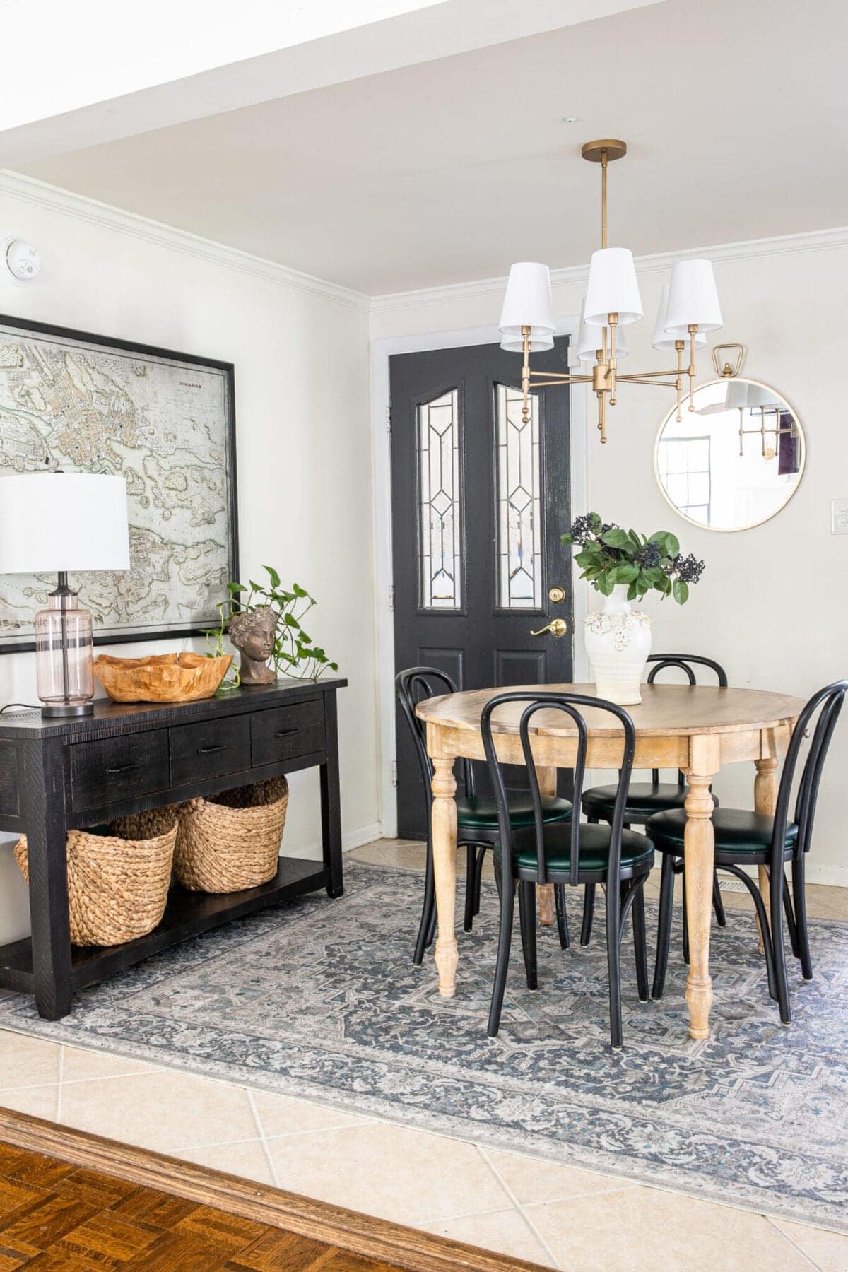 Ruggable rug in dining room with console table and shaded chandelier