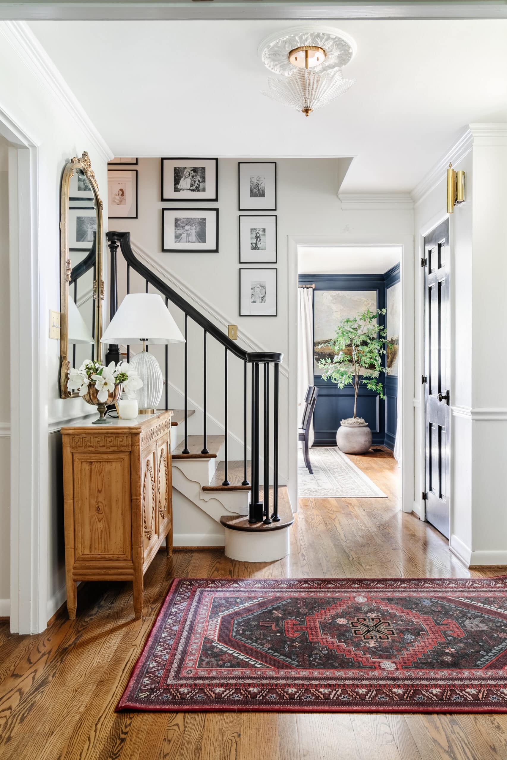 ruggable rug in an entryway at bottom of stairs